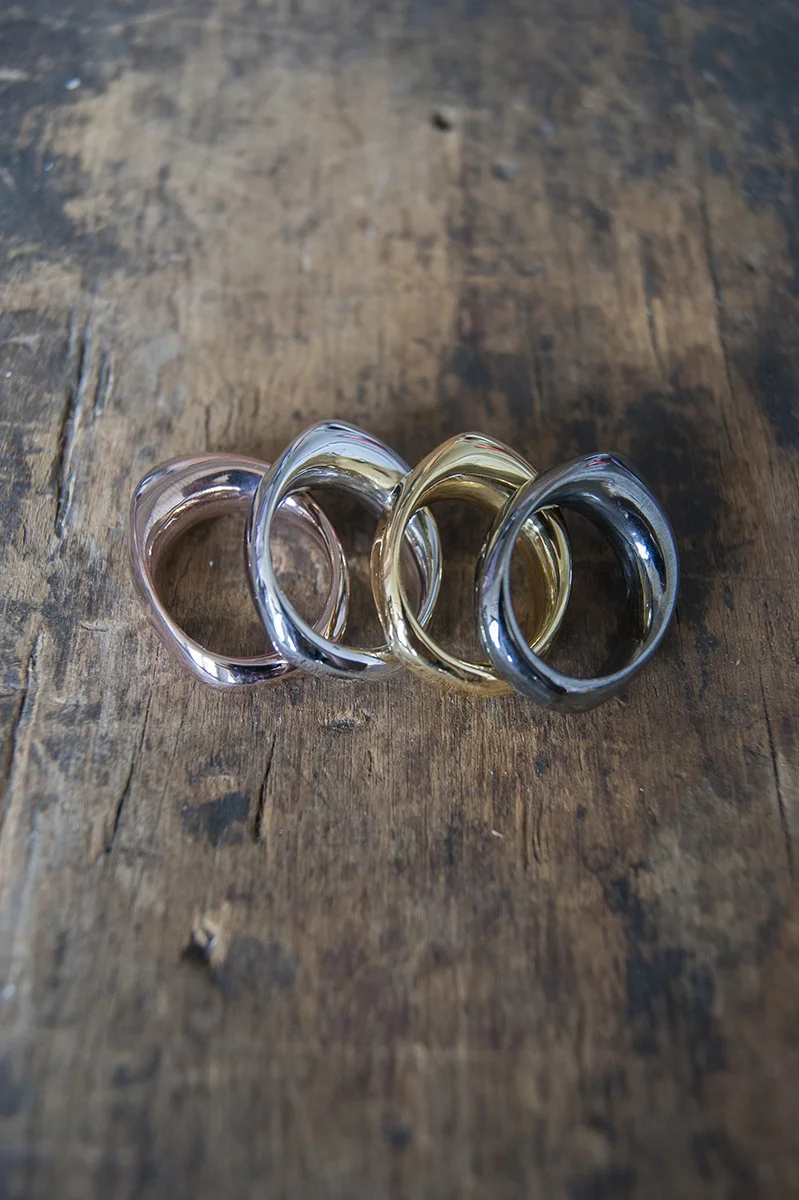 The Flex Ring in rose gold, rhodium, gold, and hematite, available here .