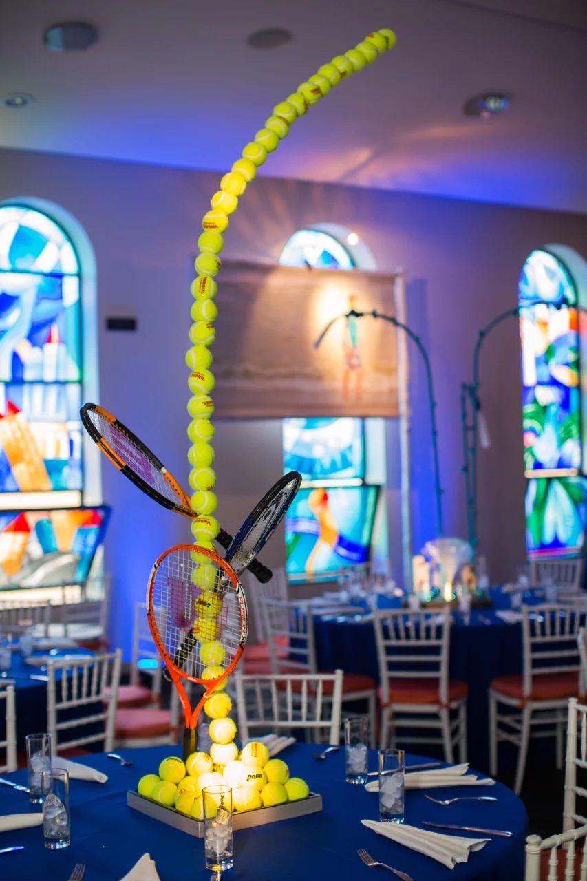 We captured the motion of a tennis ball by creating a 3D tennis ball sculpture, complete with rackets as accents