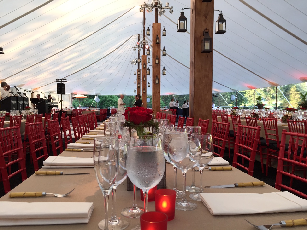 Custom tent pole surrounds with metal and glass lanterns