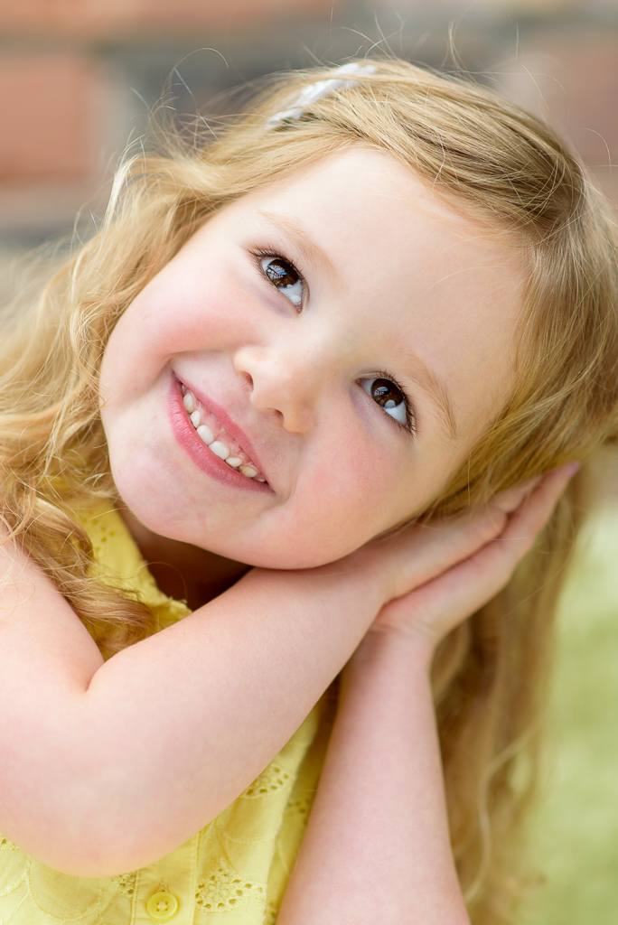 Family portrait of a happy, smiling young girl