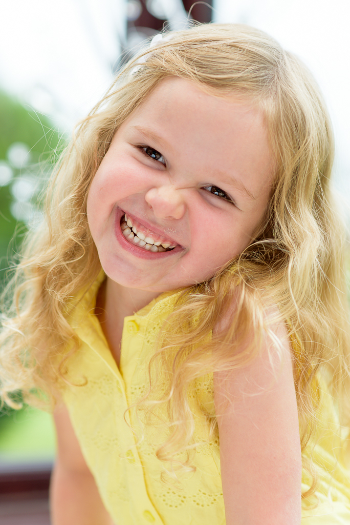 Family portrait of a happy, smiling young girl