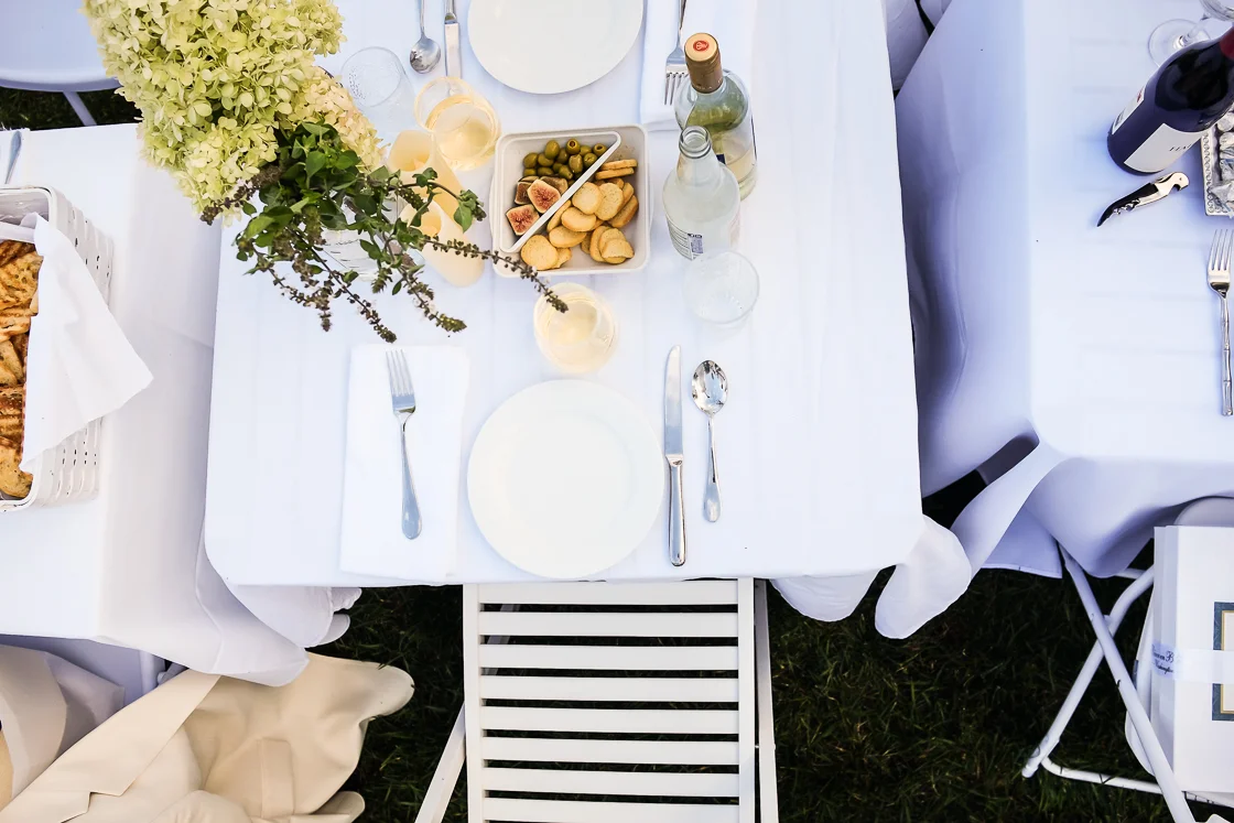 Charcuterie, white wine and ornate flower arrangements were popular picks at many tables for Diner En Blanc.