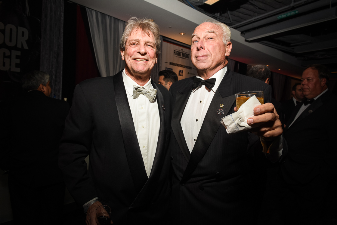 Real estate attorney Brian Sherr and Paul Biciocchi of Forum Properties cheers with a stiff drink.