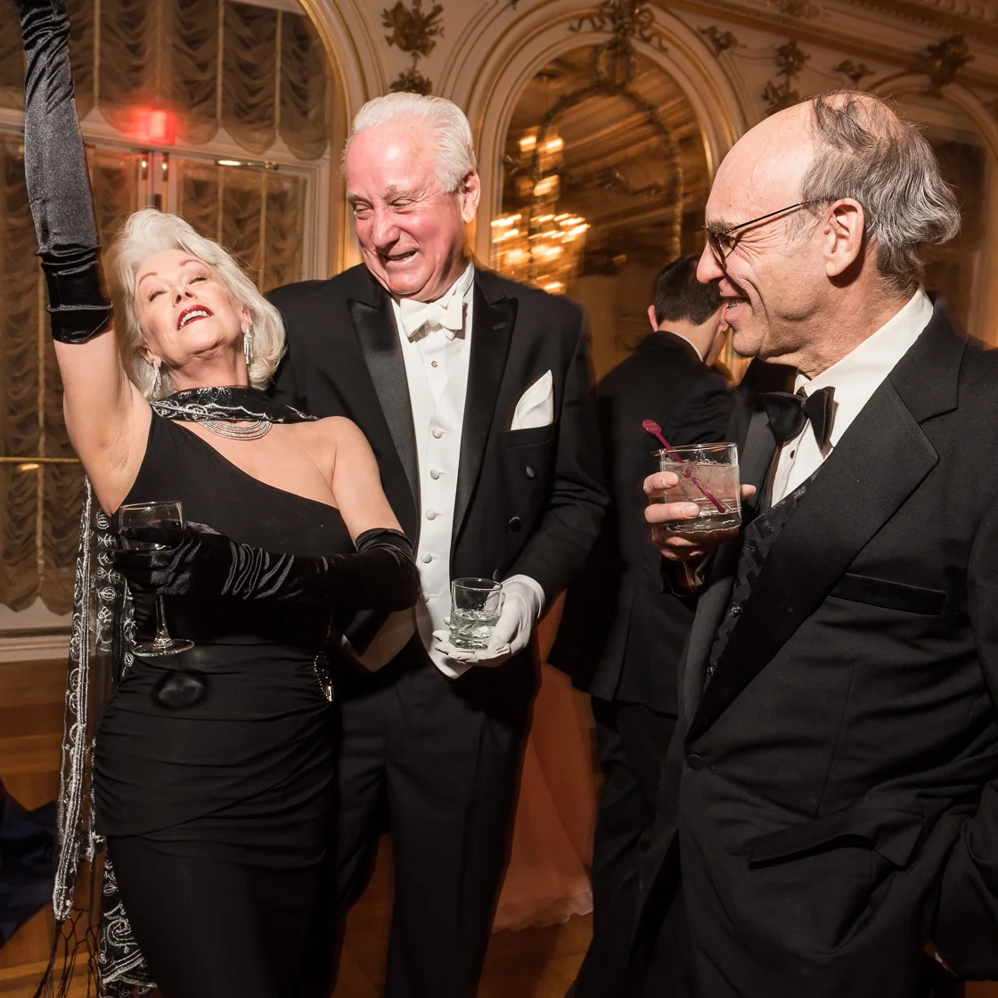 Retired society writer Robin Phillips shows off her fabulous side as Timothy Thomas and scientist Andrew Sostek look on.