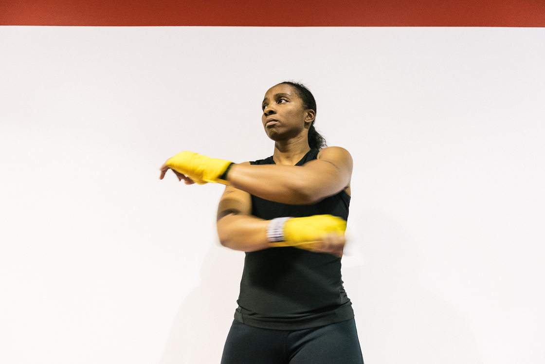 Nelson warms up her arms after donning her hand wraps at the beginning of practice.