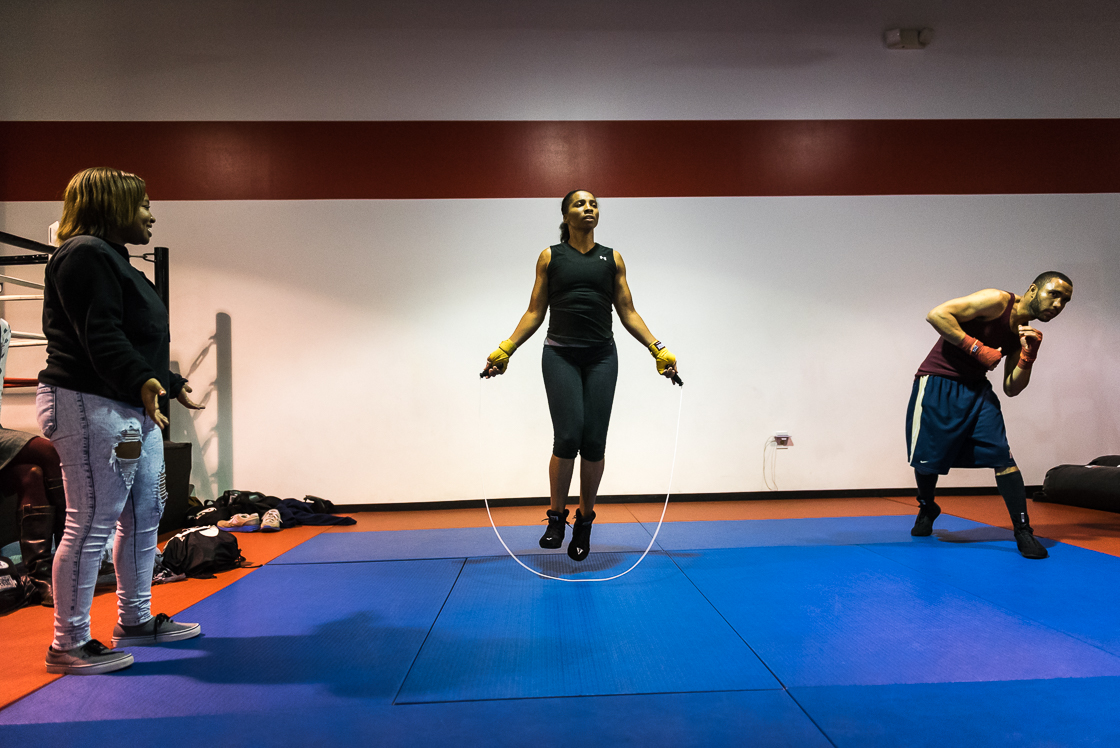 Nelson jumps rope as her daughter Simone Barnes watches from the sidelines. Many female boxers are encouraged to dress provocatively and in full faces of make-up for fights, but Nelson says, “No, Lord, I’m a Christian, I’m a mom. I can’t do that. If my talent don’t sell it, I’m sorry.”