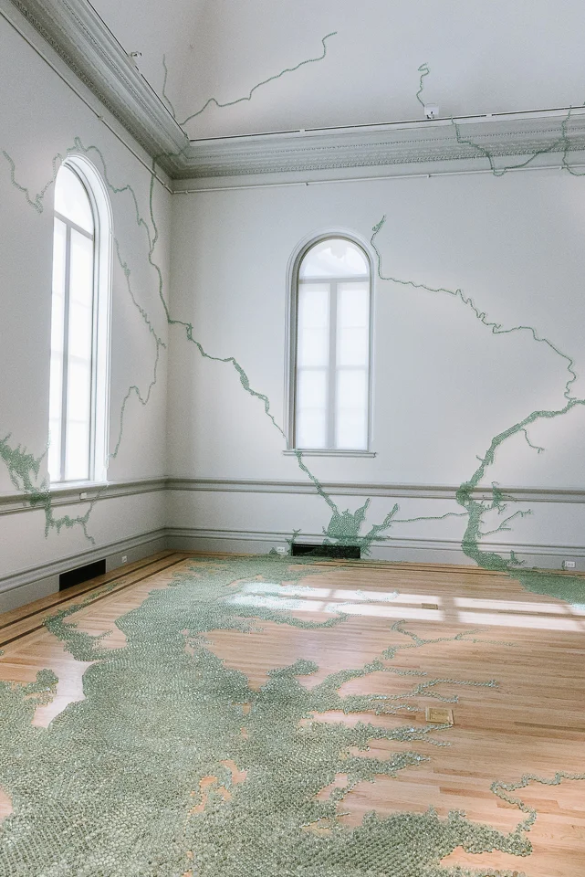 Maya Lin used a forgotten glassblowing technique to create the marbles used to construct this map of the Chesapeake Bay tides. 