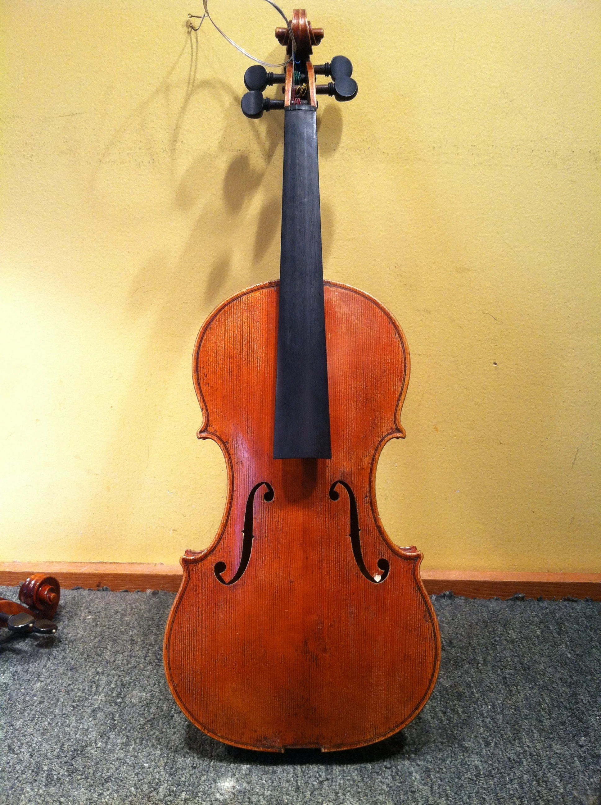  Front back on. &nbsp;Suprisingly, the only piece that was missing was a tiny bit of wood from the lower wing of the f hole, so had to add a piece there 