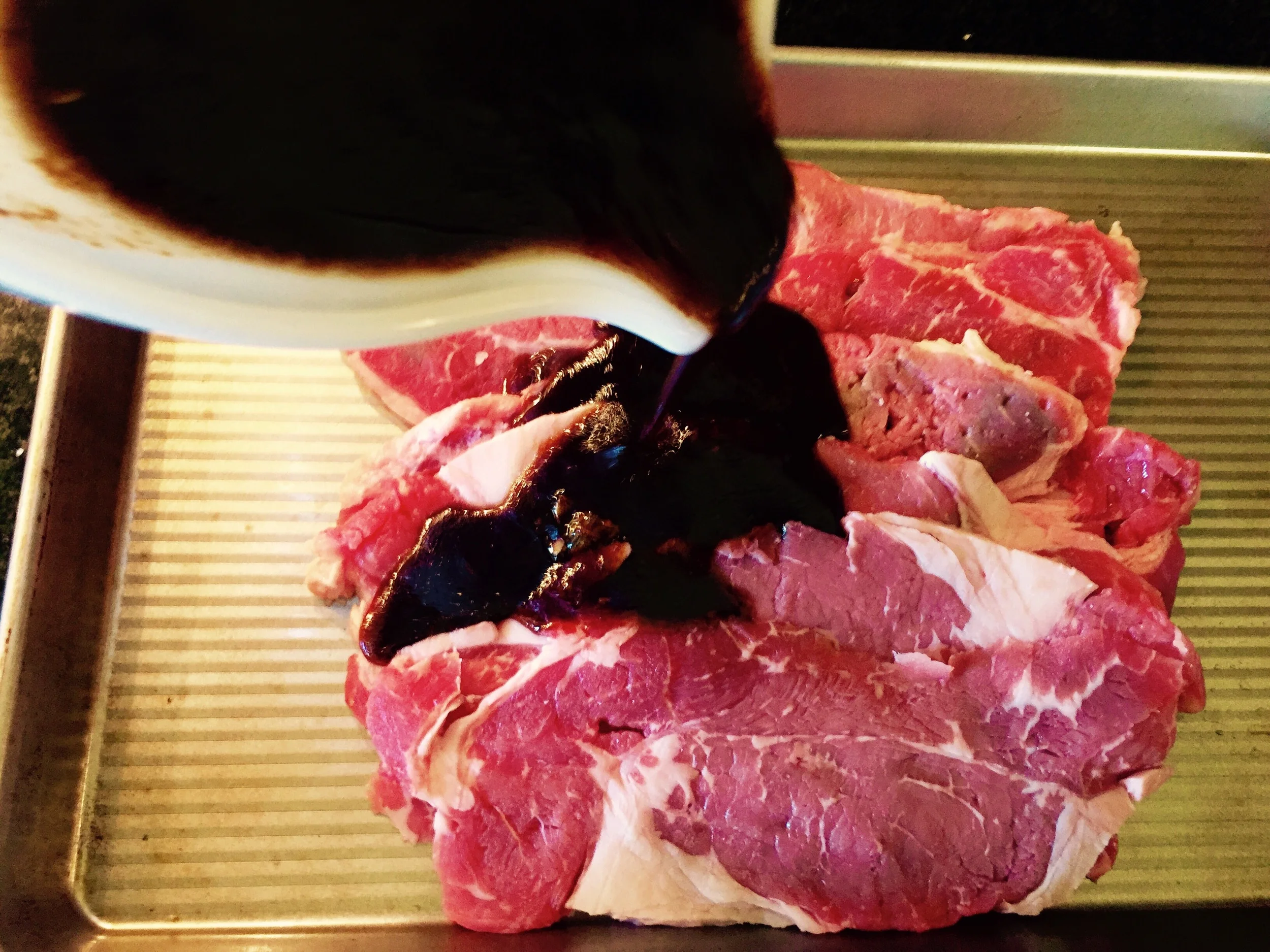 Pour on the marinade and coat both sides.