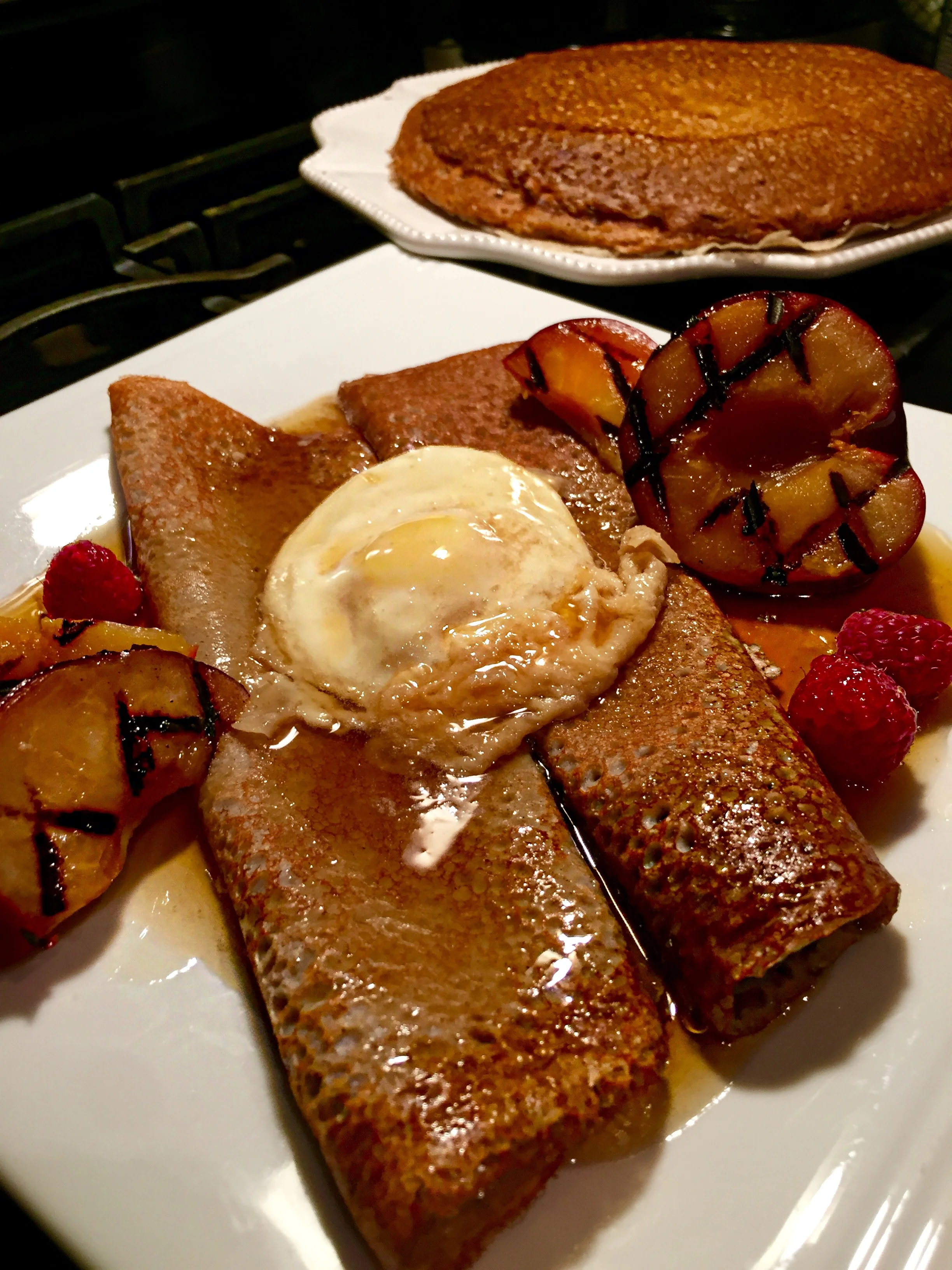 Buckwheat Crêpes with Maple Syrup Poached Egg and Grilled Plum