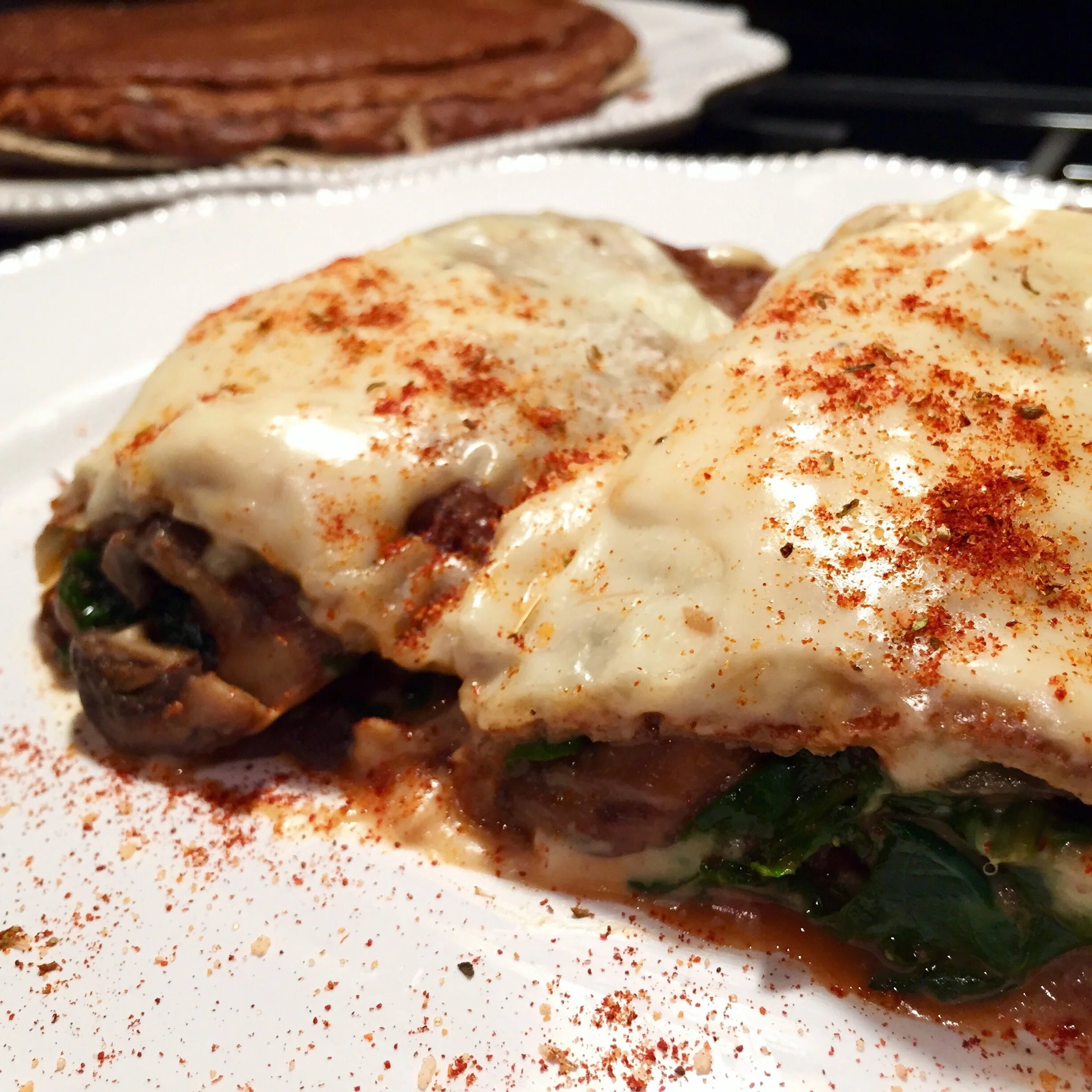 Buckwheat Crêpes Stuffed with Chicken Spinach and Mushroom, finished with a Smoked Gruyère Cream Sauce