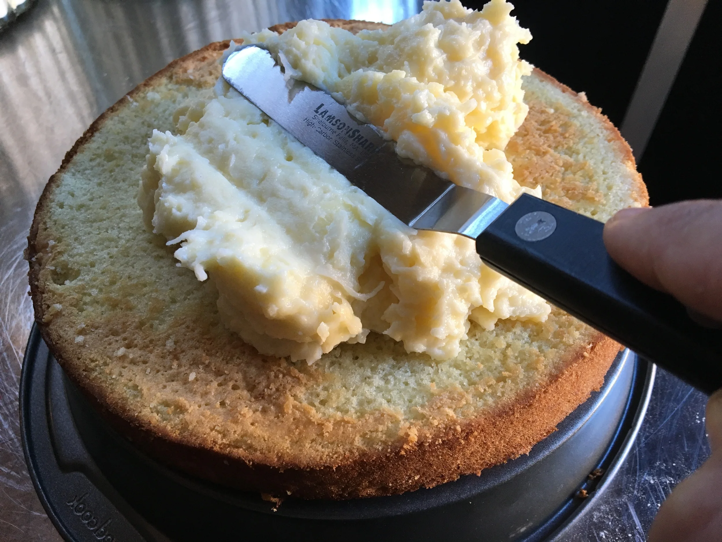 After brushing on the Whiskey Syrup, start layering the coconut cream pudding