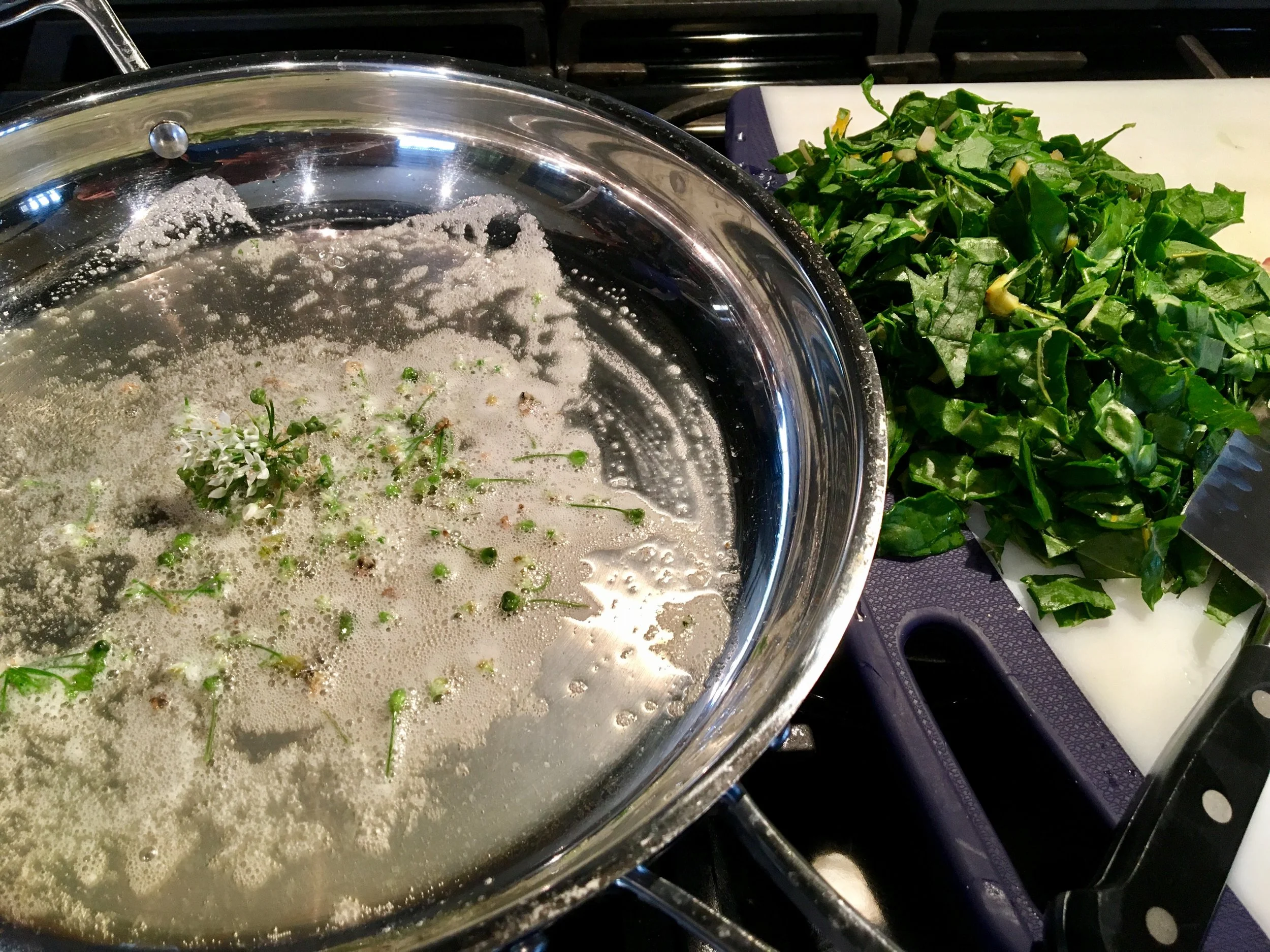 warming the garlic-chive buds and ready to cook the swiss chard.