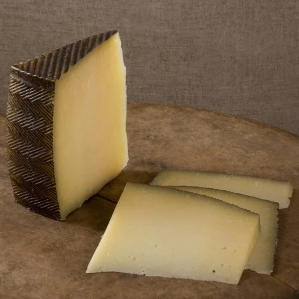 firm, rich, not too salty, spanish Manchego cheese 