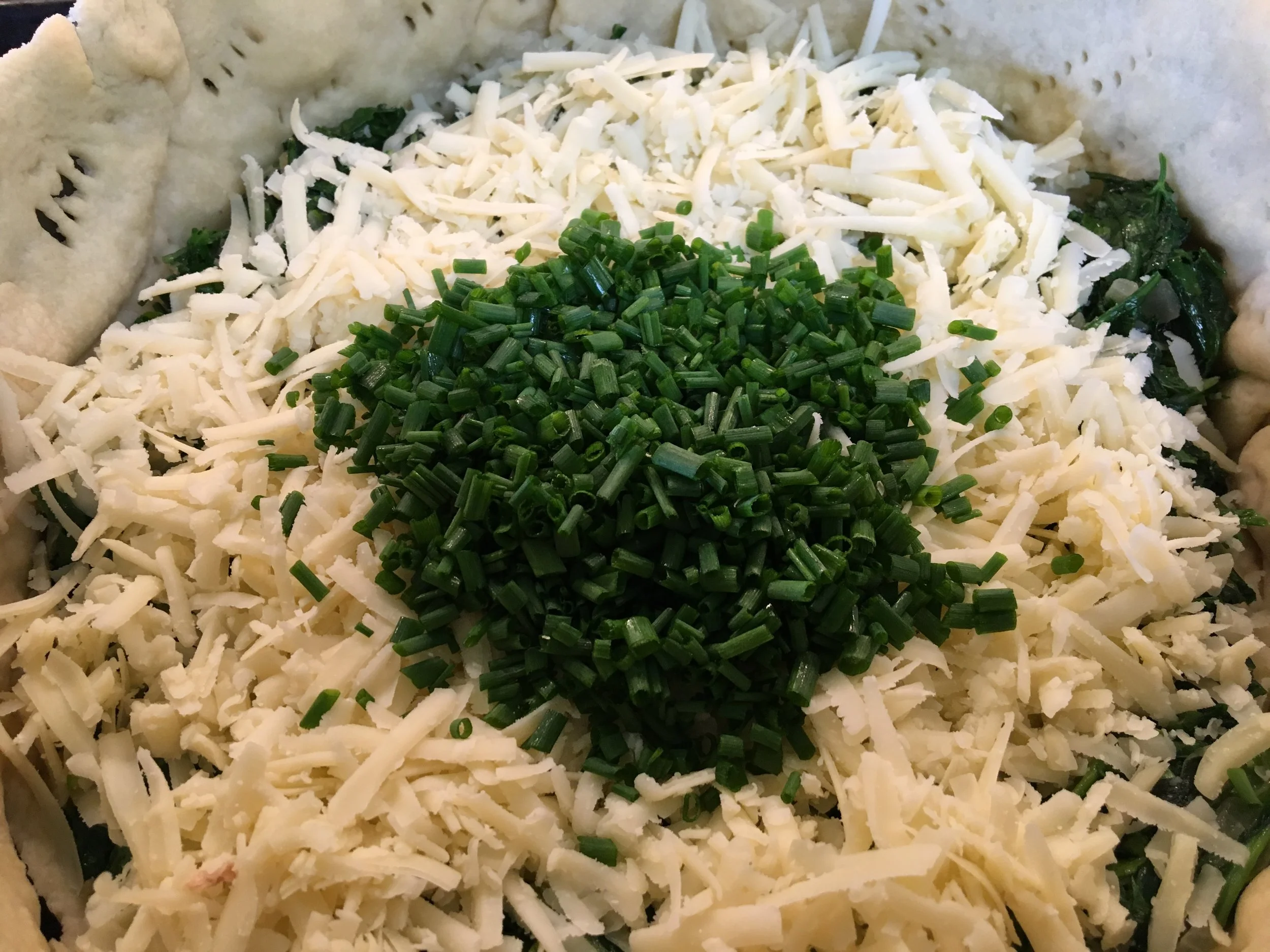 Greens and Cheese added... waiting on the custard base.