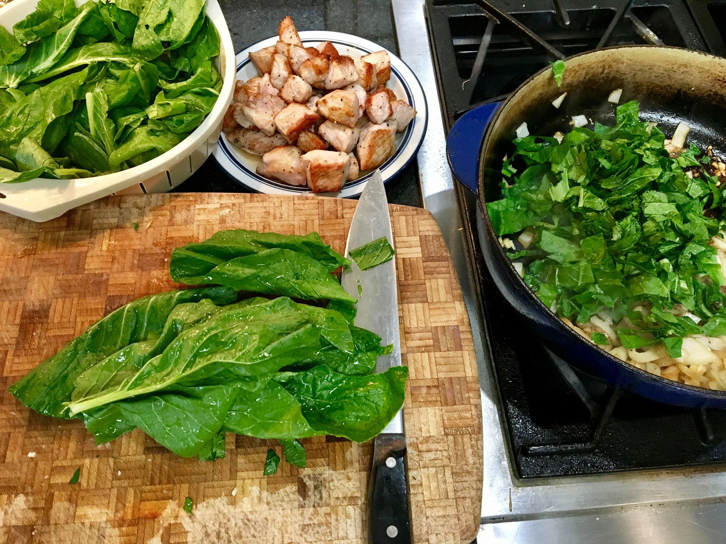 Adding chopped mustard greens to the mix. 