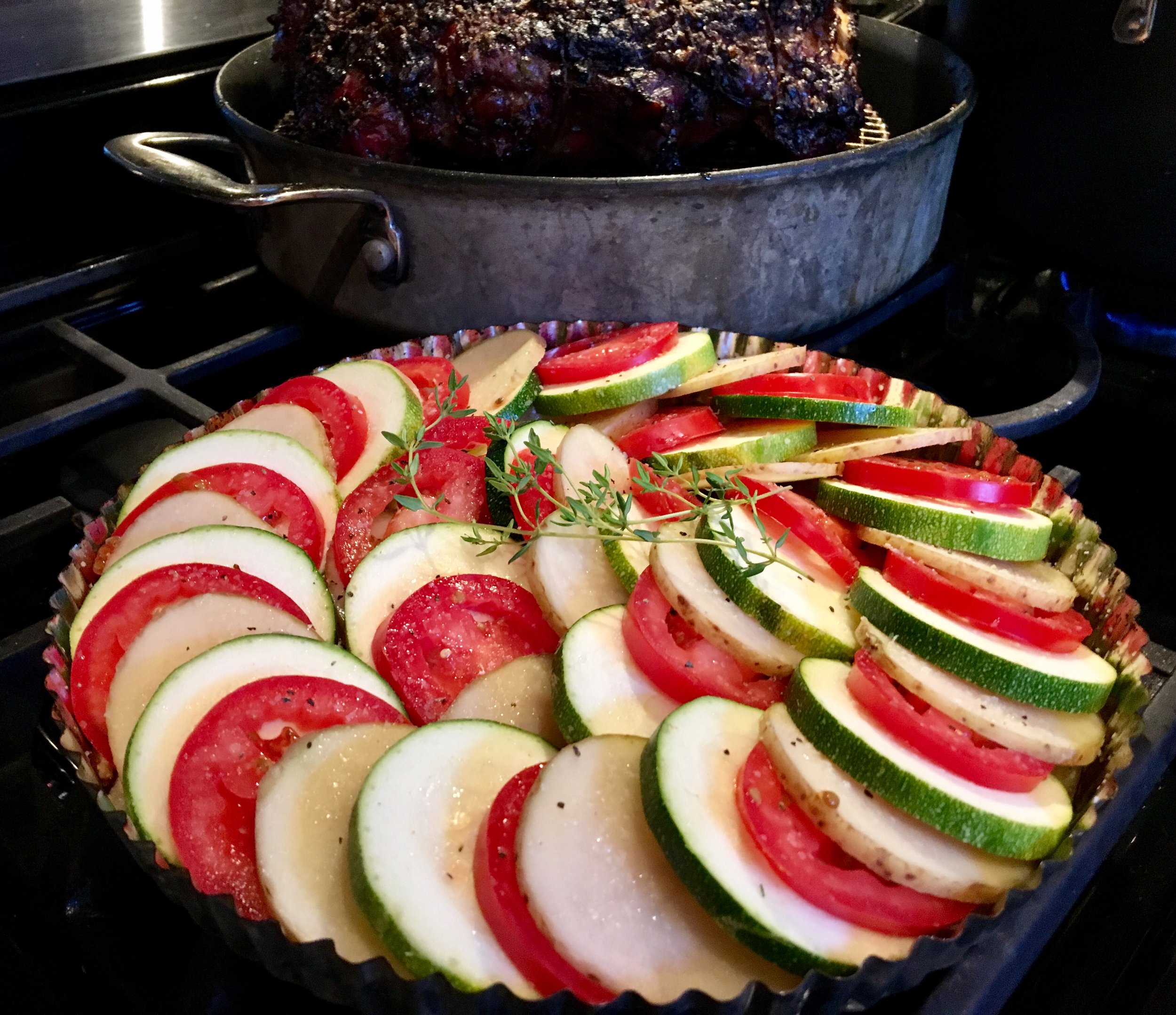 Tian almost ready for the oven, as the Roasted Prime Rib rests before slicing! 