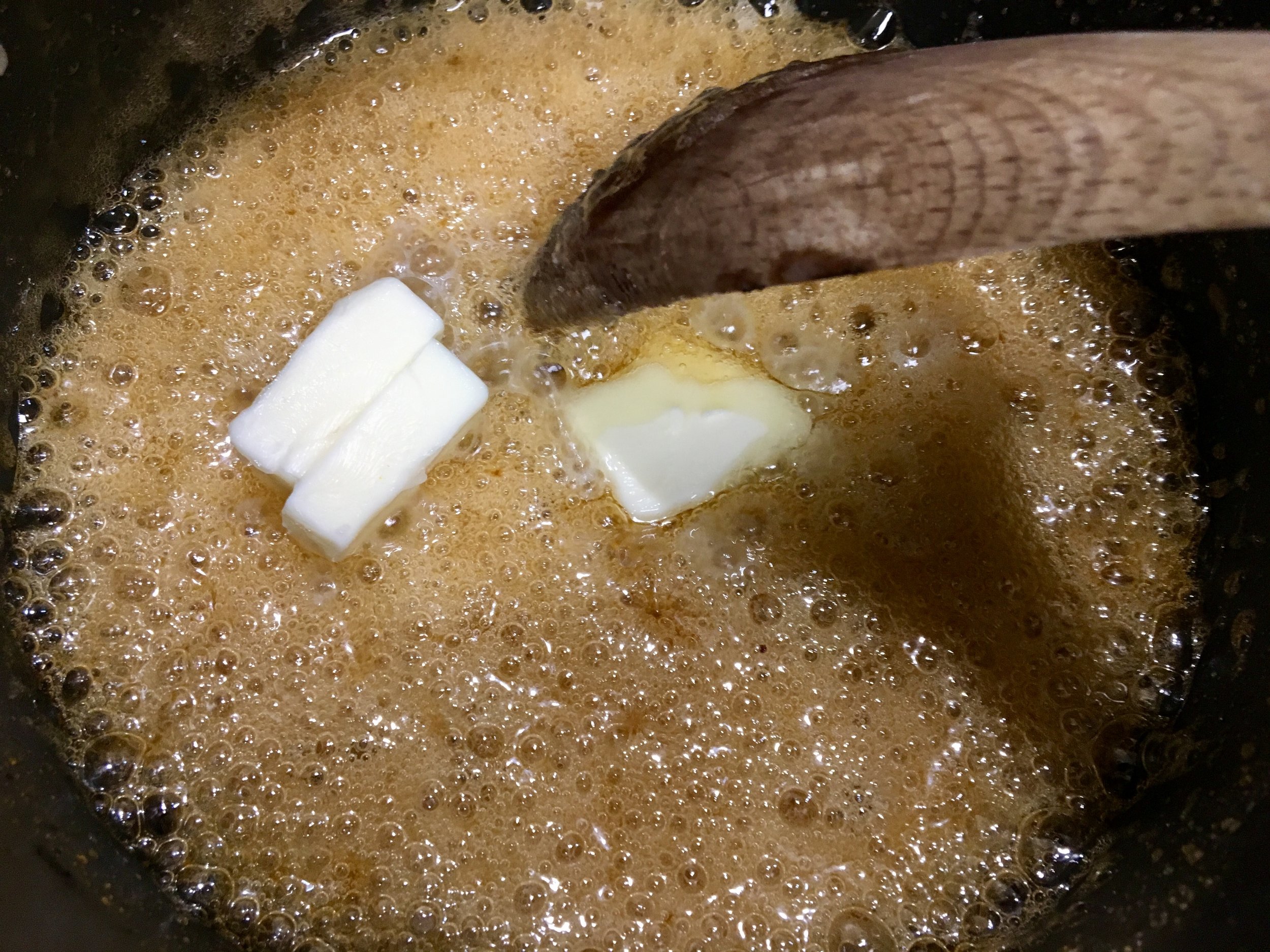 Adding butter to the caramel
