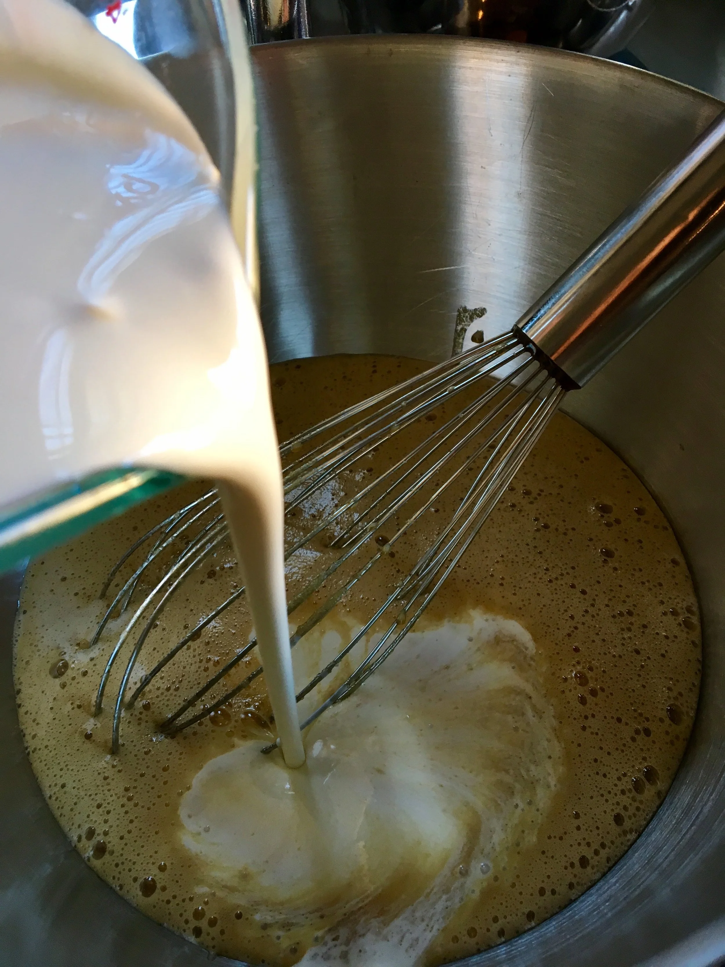 Adding in the cream and milk. 
