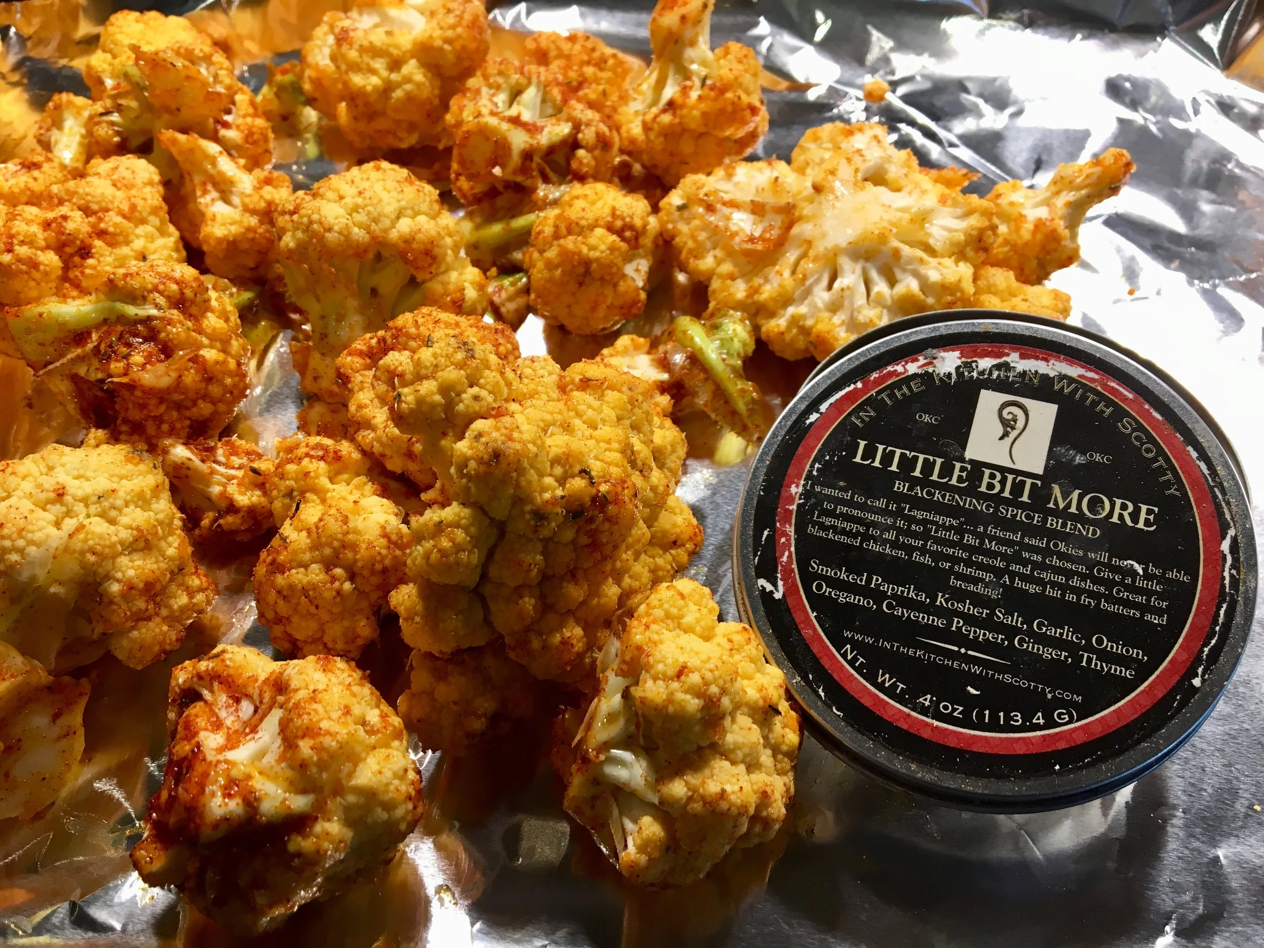 Tossing cauliflower with In The Kitchen With Scotty "Little Bit More" Spice Blend before roasting.