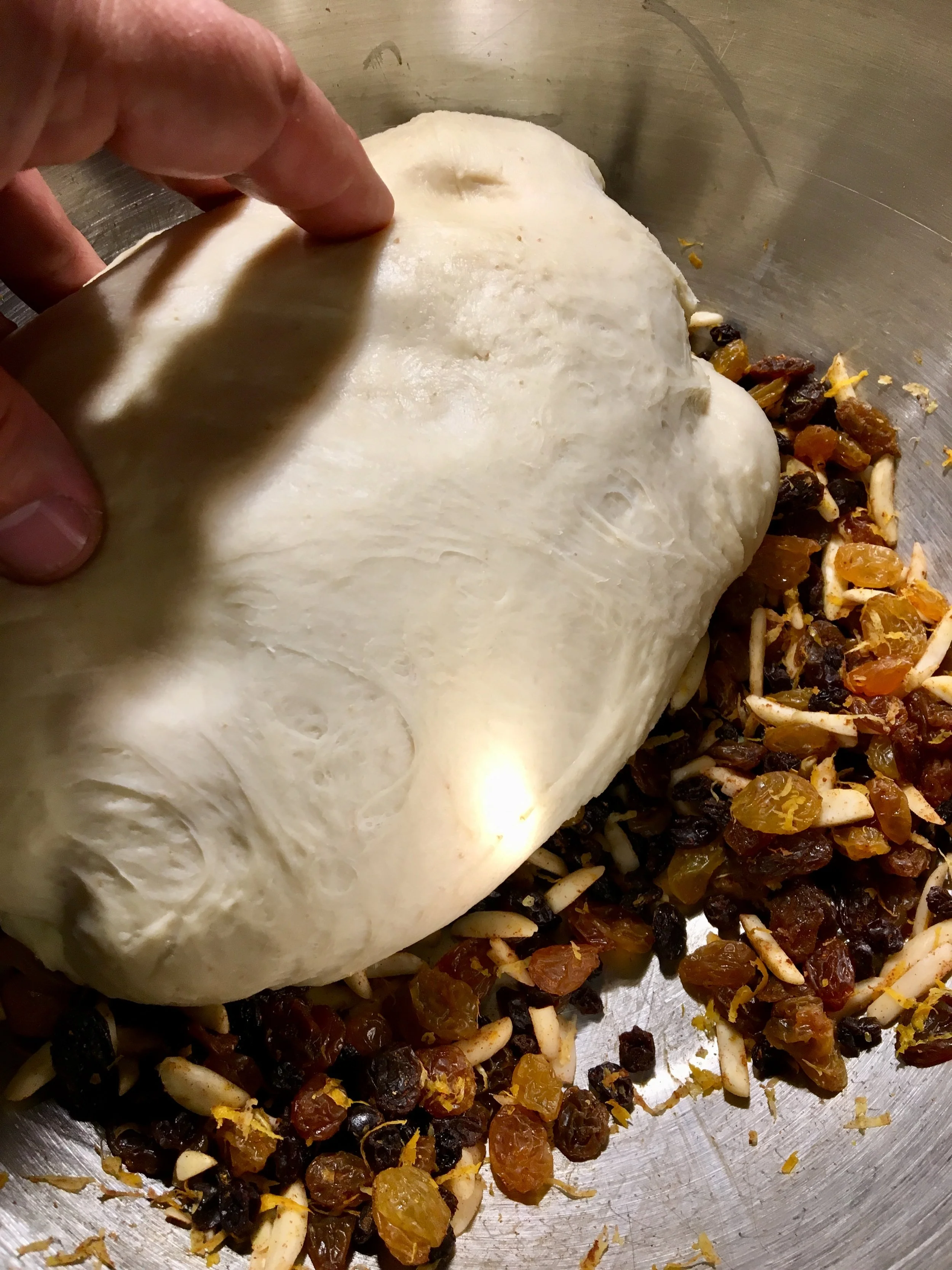 The dough is made, time to press it into the fruit and almonds.