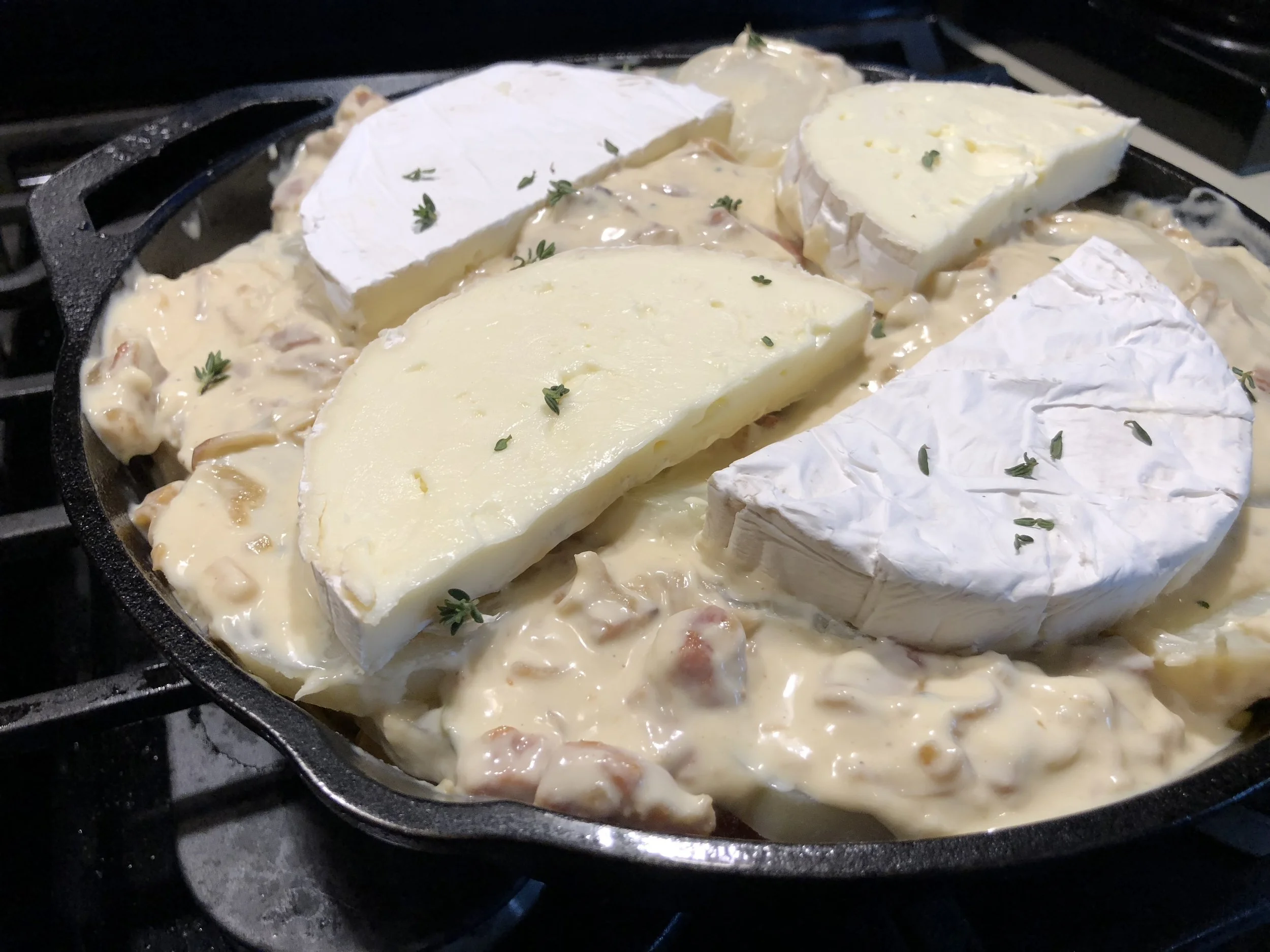 Layer with crème fraîche, bacon and onions, and CHEESE! 