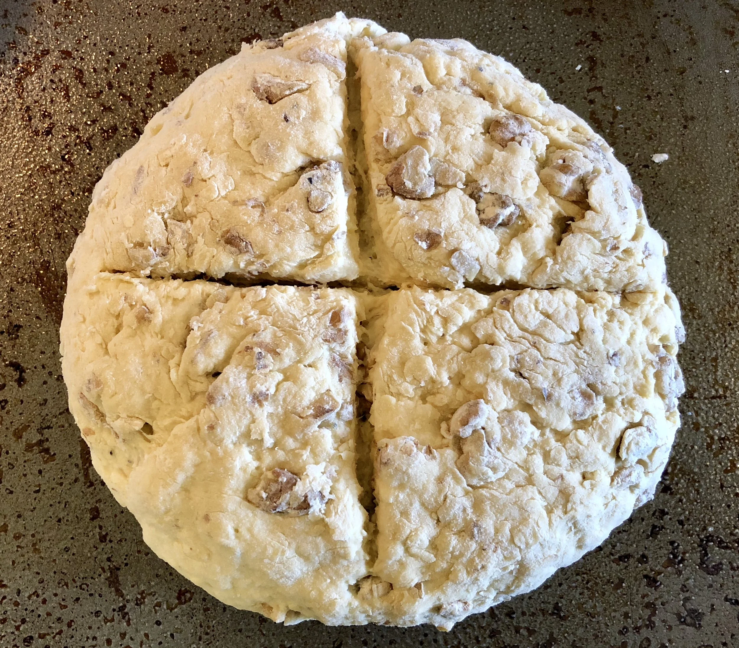 After working in the walnuts, for, X, brush the top and sides wit buttermilk, and place on a baking sheet for the oven. 