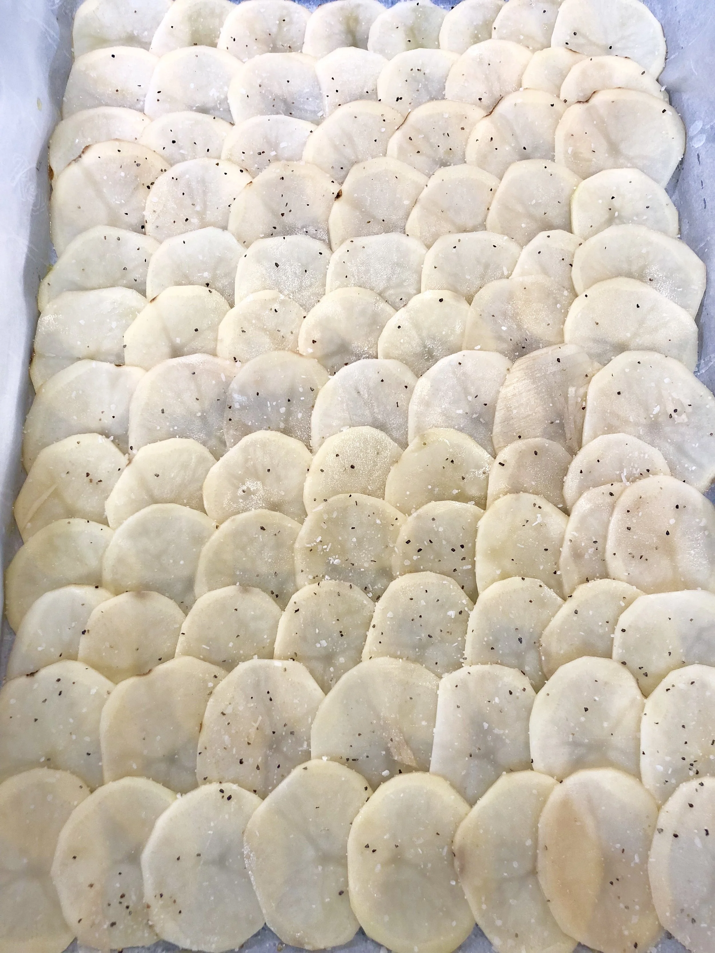 Shingles potatoes. Add Parmesan and pop into the oven until golden brown and cheesy. 