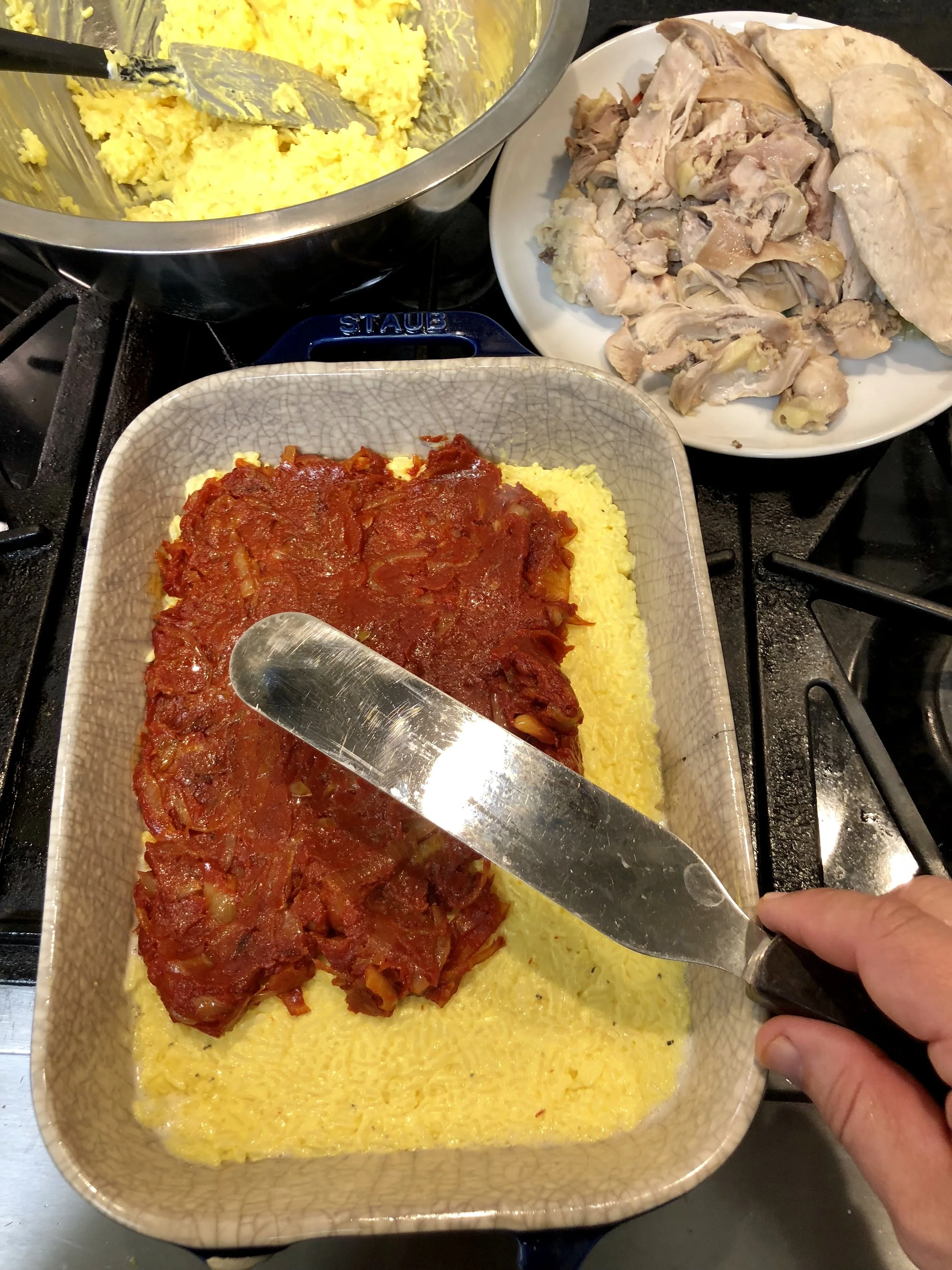 The first layers of saffron rice and shallot-tomato. 