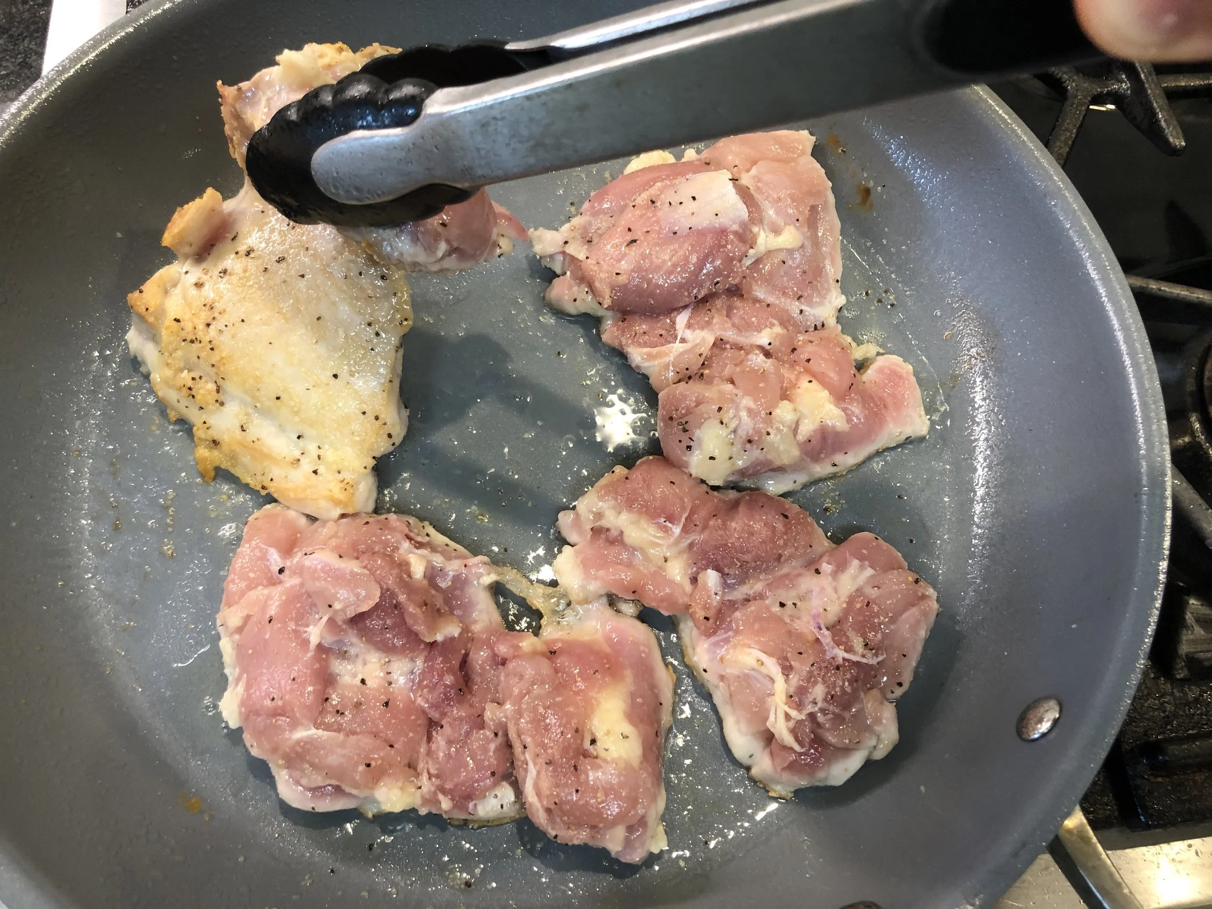 Browning then roasting chicken thighs.