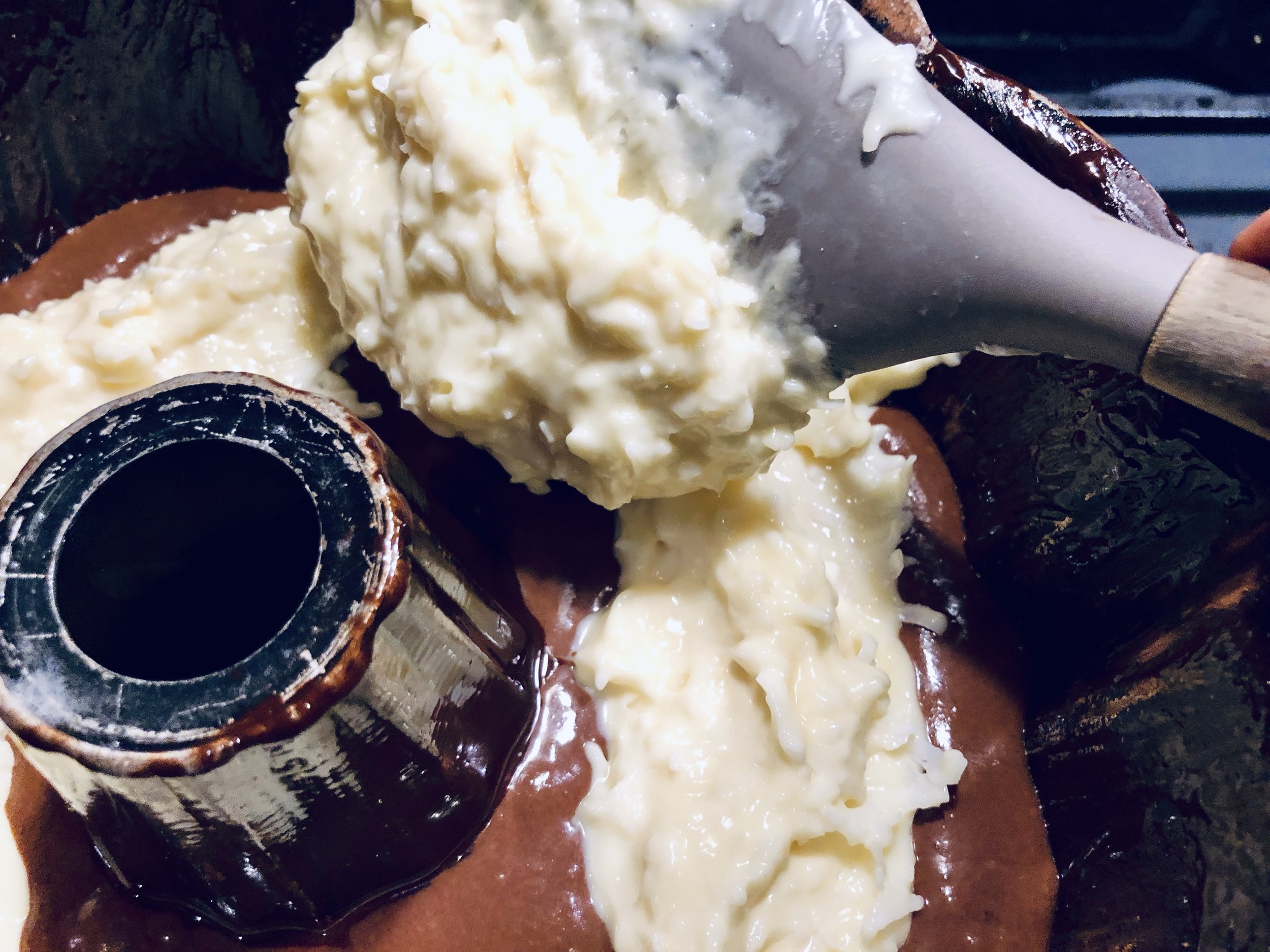 The coconut batter is heavier and will sink while baking, causing your tunnel to be at the top of each slice rather than in the center… like mine. Add 3/4 of the chocolate batter to the pan, then layer in the coconut. This will give a stronger foundation. I think.