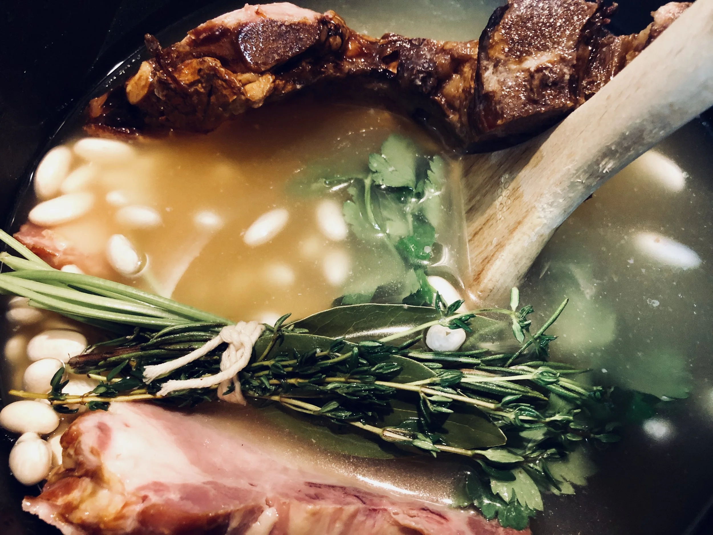 Beans cooking with the Bouquet Garni , smoked neck-bones, and smoked pork chop!