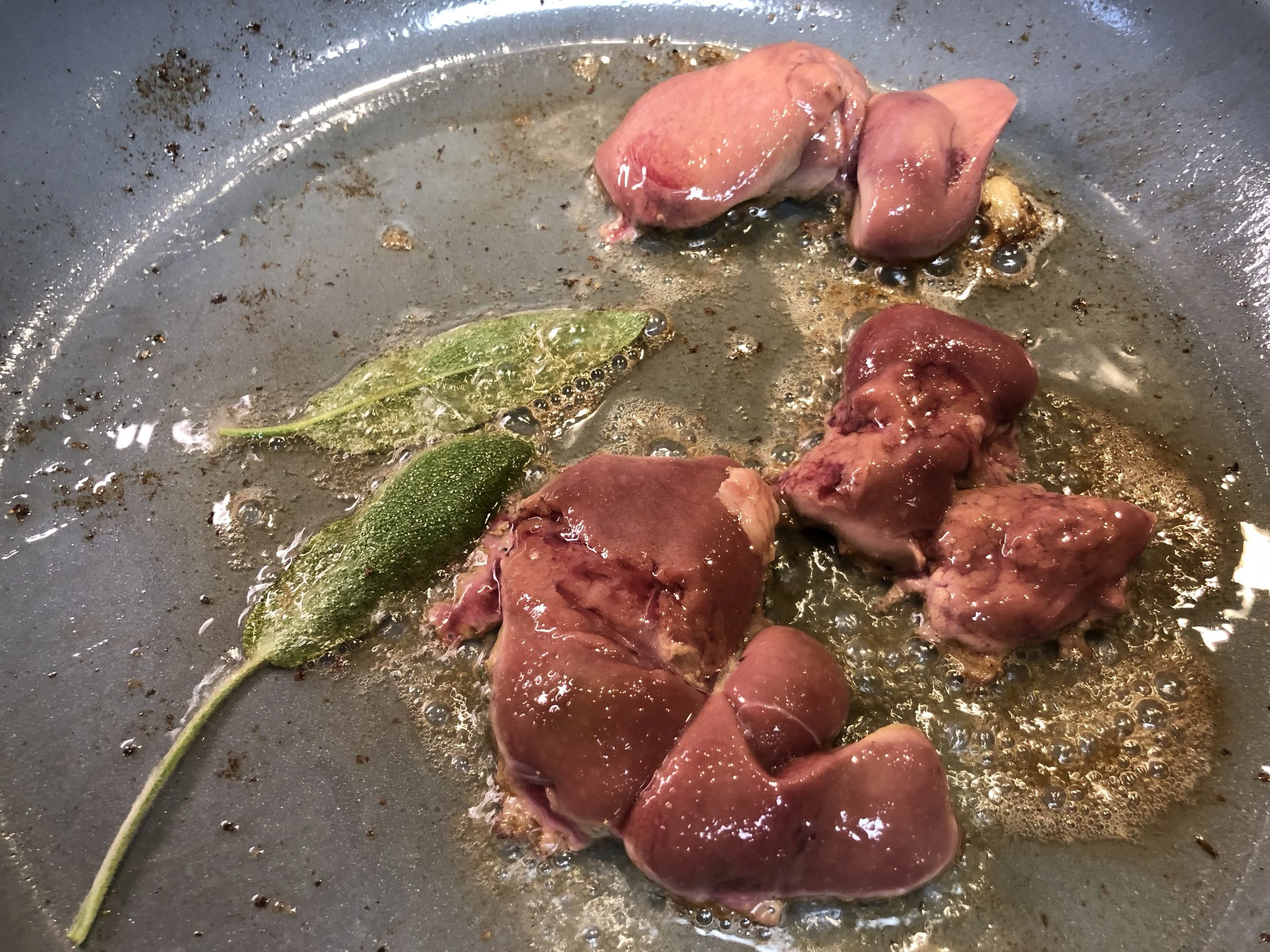 Sautéing the chicken livers.