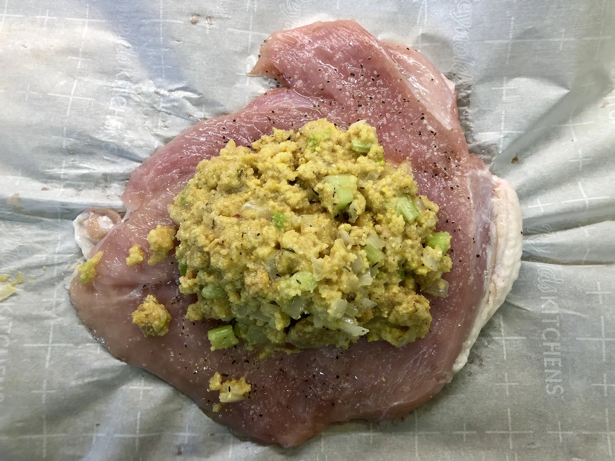 Pound the split turkey breast to one even thickness, then add the dressing.