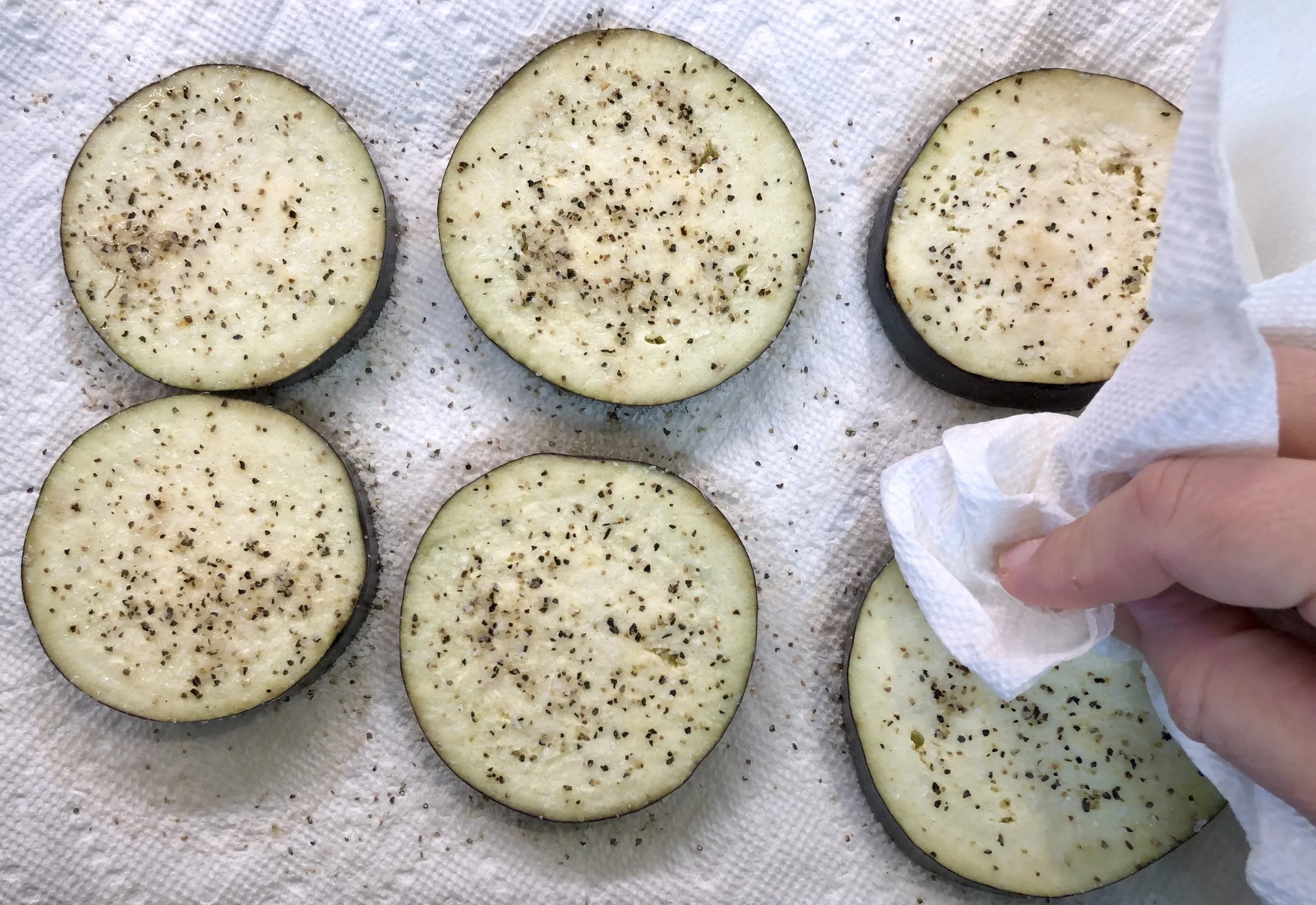 Blot the salted eggplant before frying.