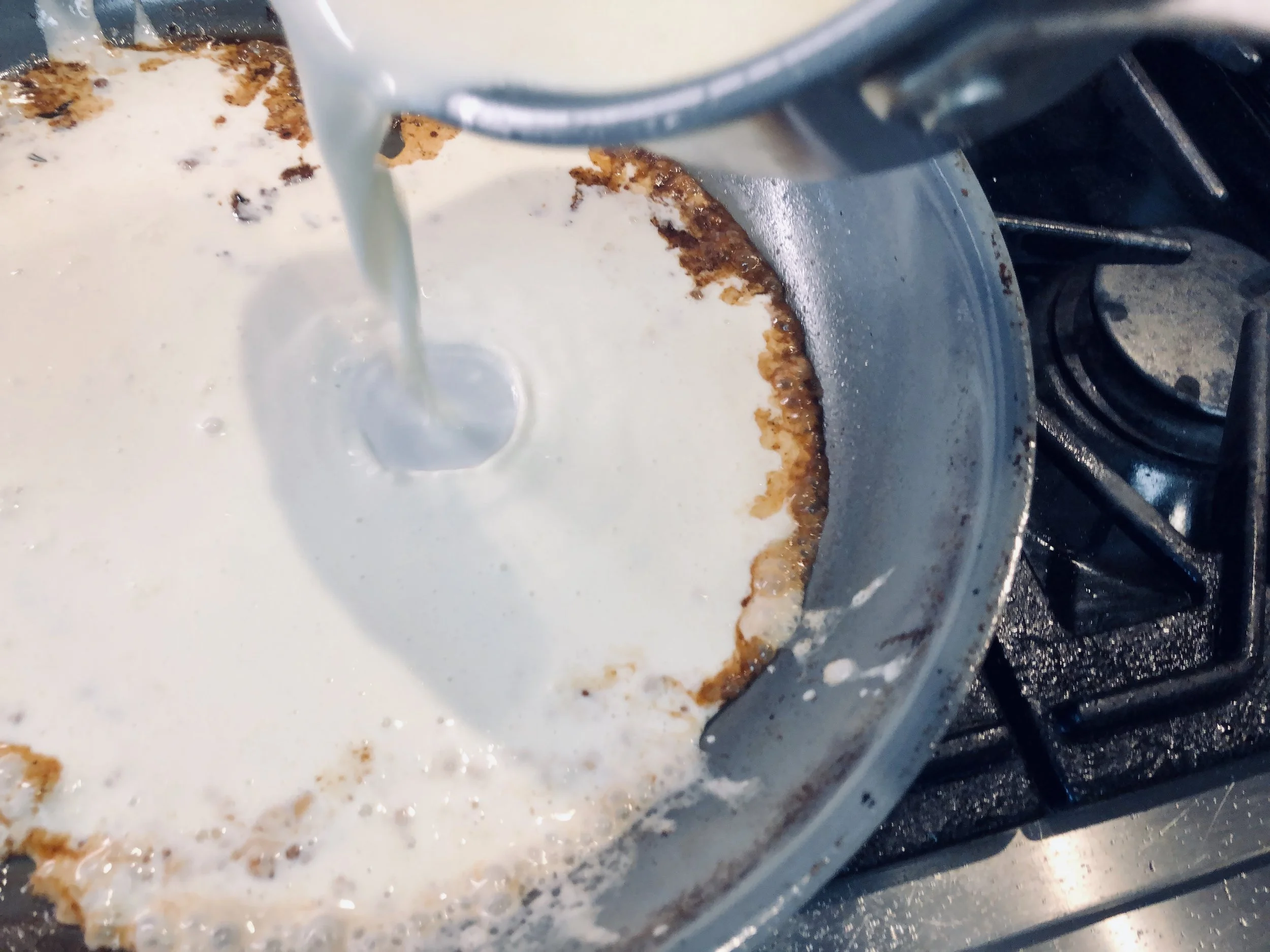 Deglazing the pan with port and cream.