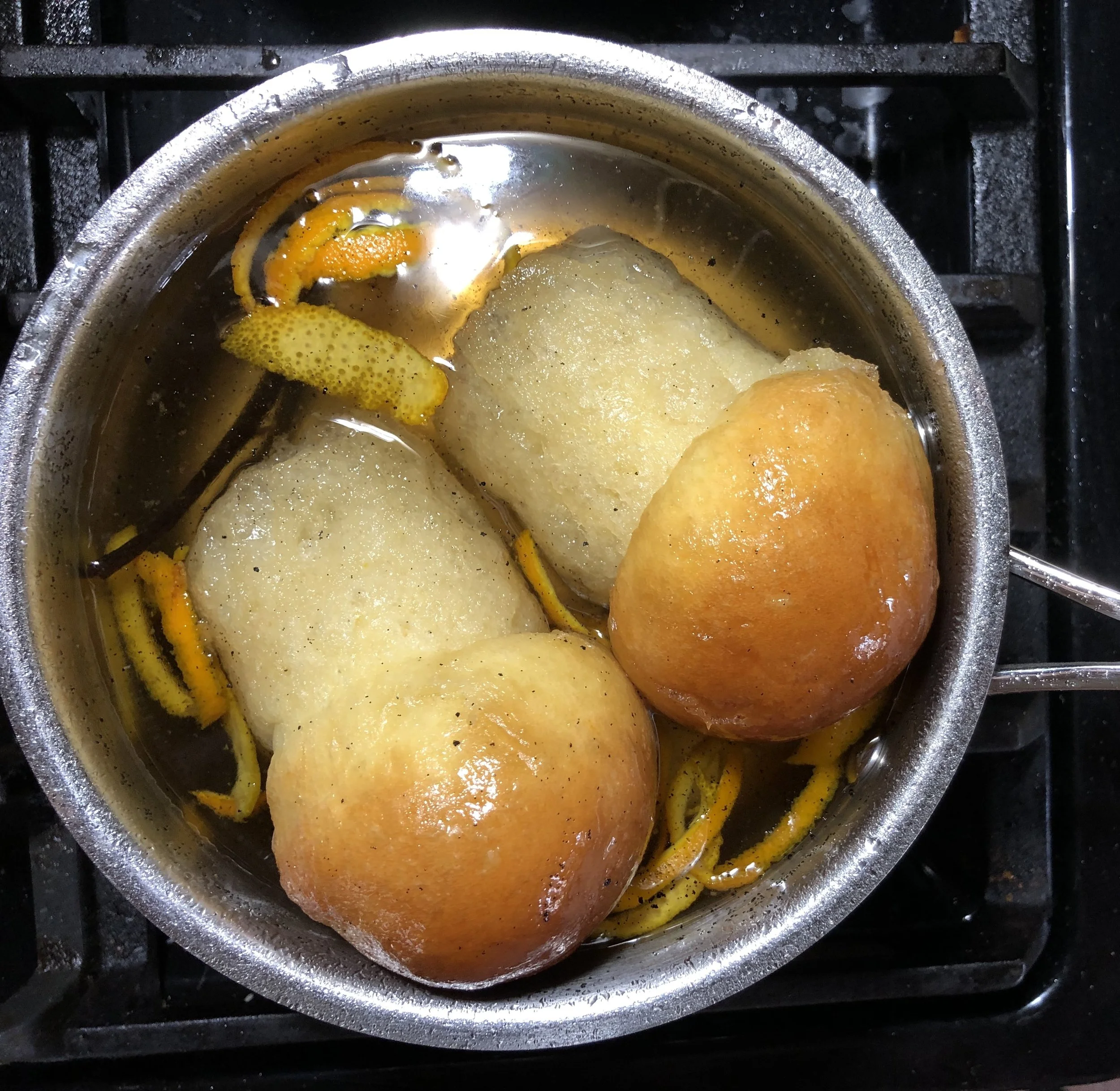 A hot simple syrup with orange peel, vanilla and of course, RUM! Allow the babas to soak 1-2 minutes, then drip-dry!
