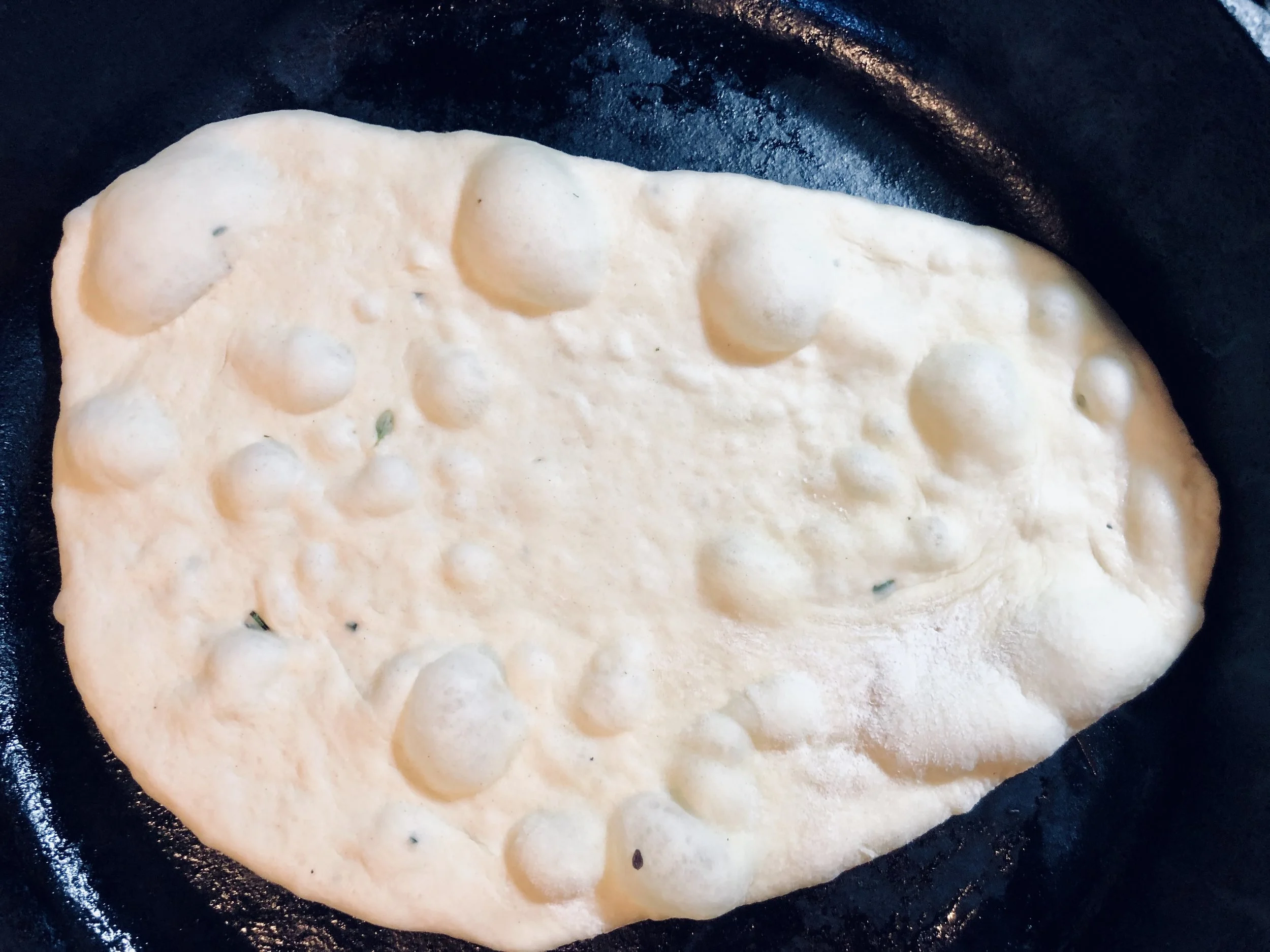 Grill in a hot cast iron pan until it bubbles… then flip!
