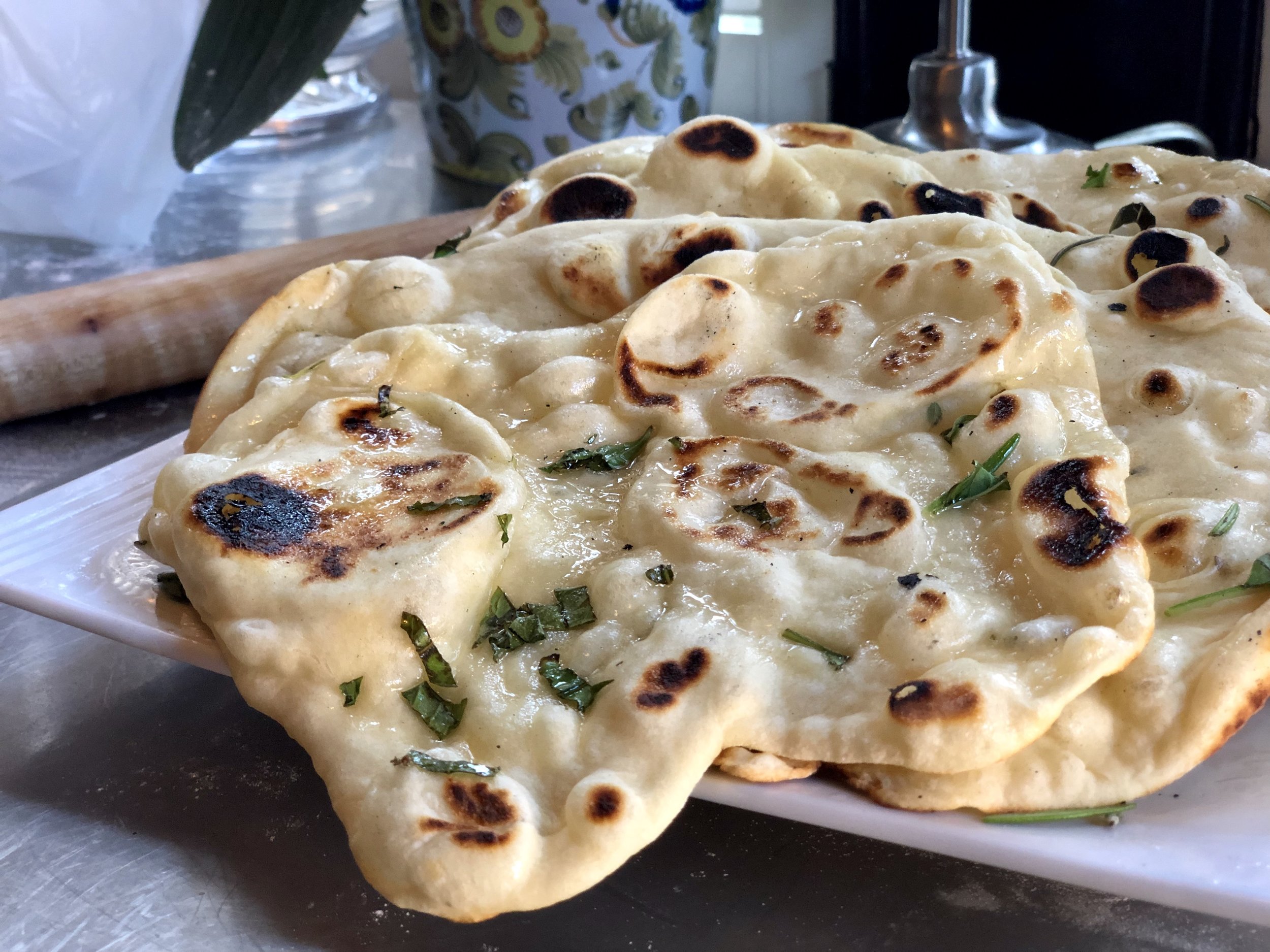 Butter each slice and sprinkle with more fresh herbs.