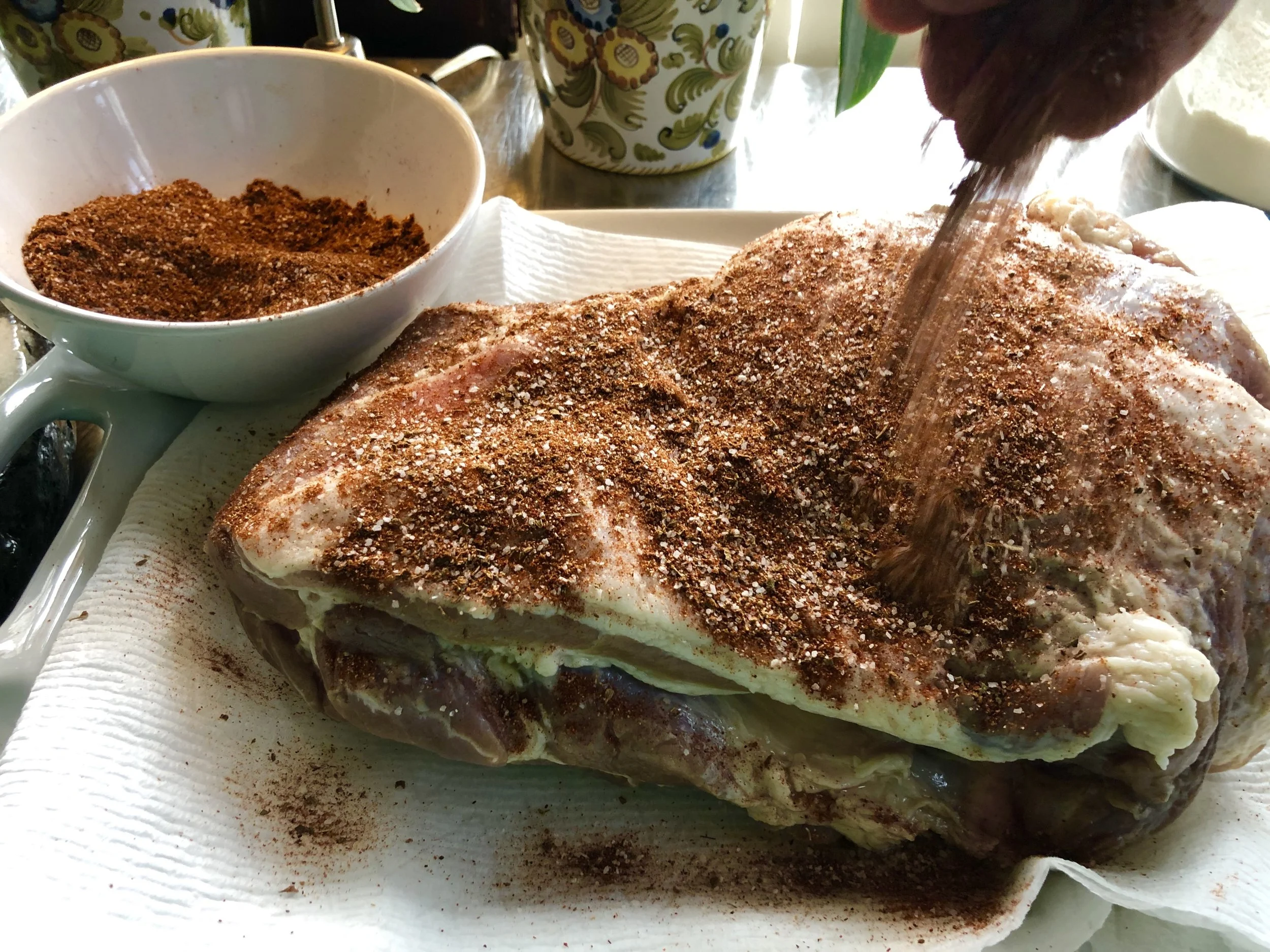 Generously coat the pork shoulder with your al pastor seasoning.