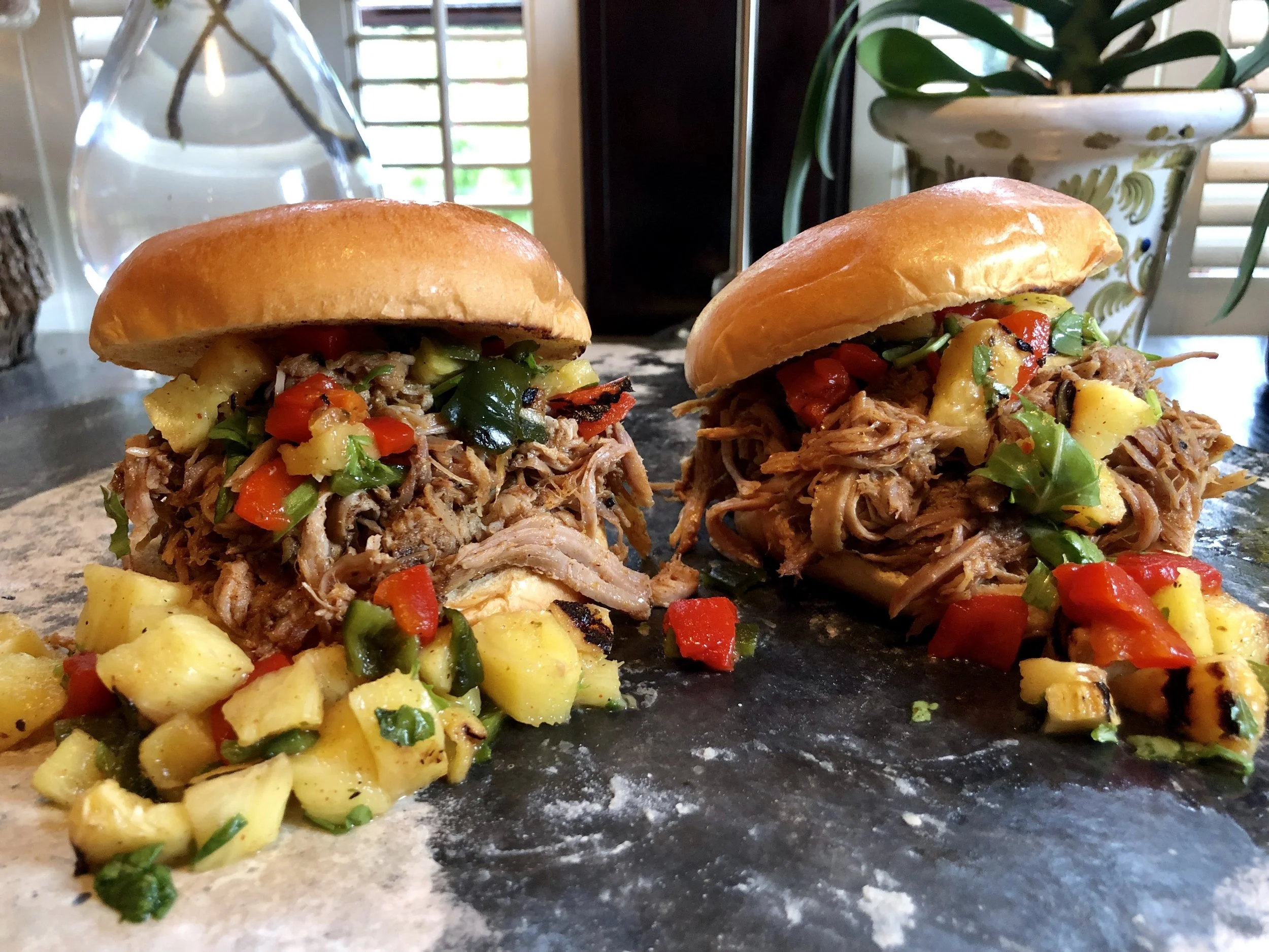 Chop up grilled pineapple, roasted Poblano and Red Chilis, cilantro, and fresh orange juice for a vibrant topping to your shredded pork sandwiches.