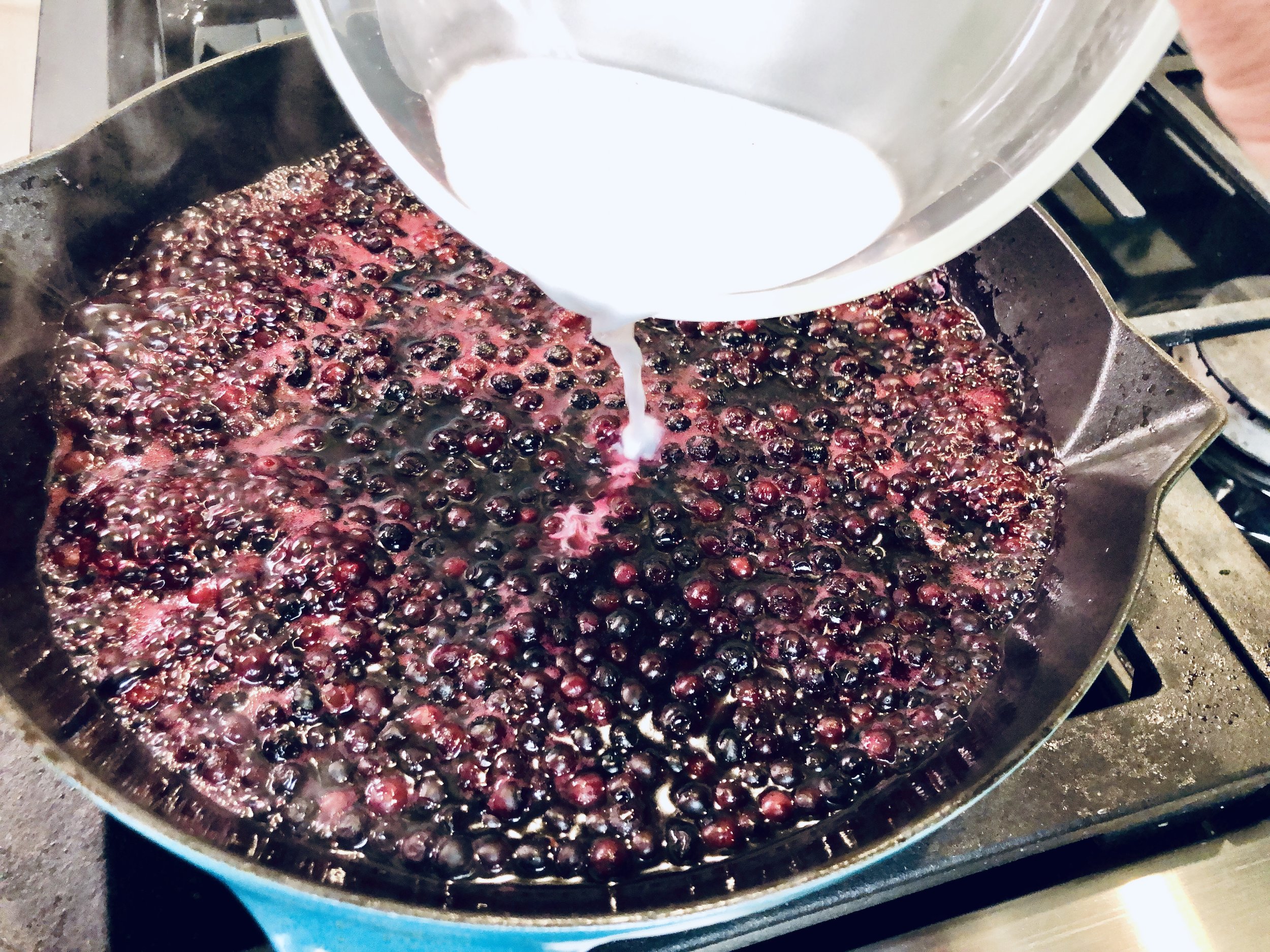 Pour in the cornstarch slurry and allow it to bloom while cooking in the sauce.