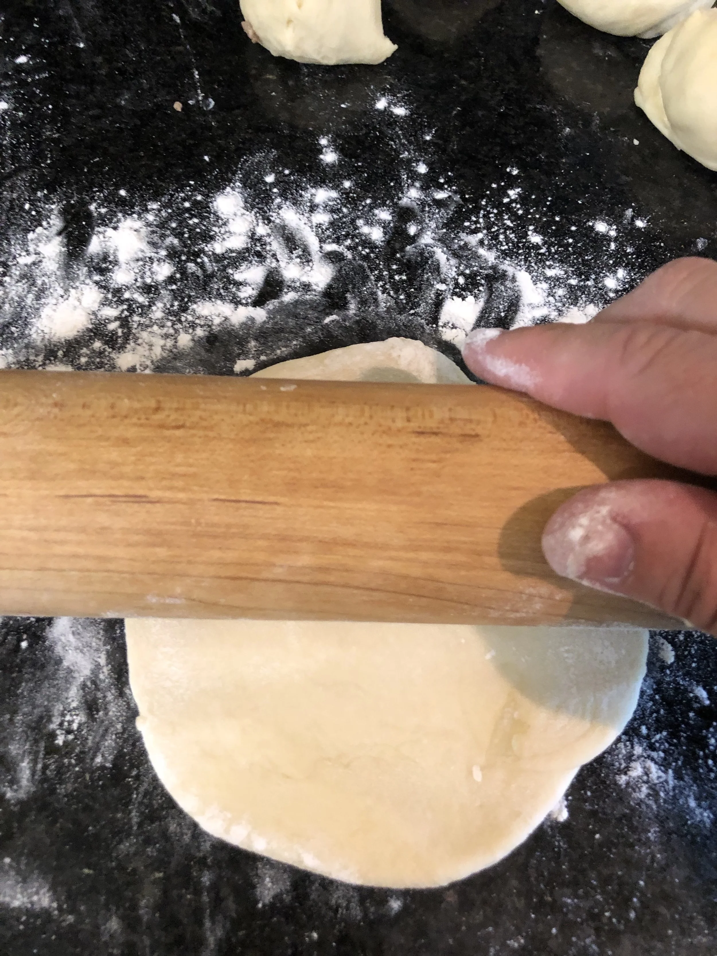 Roll the dough balls out into a circle.