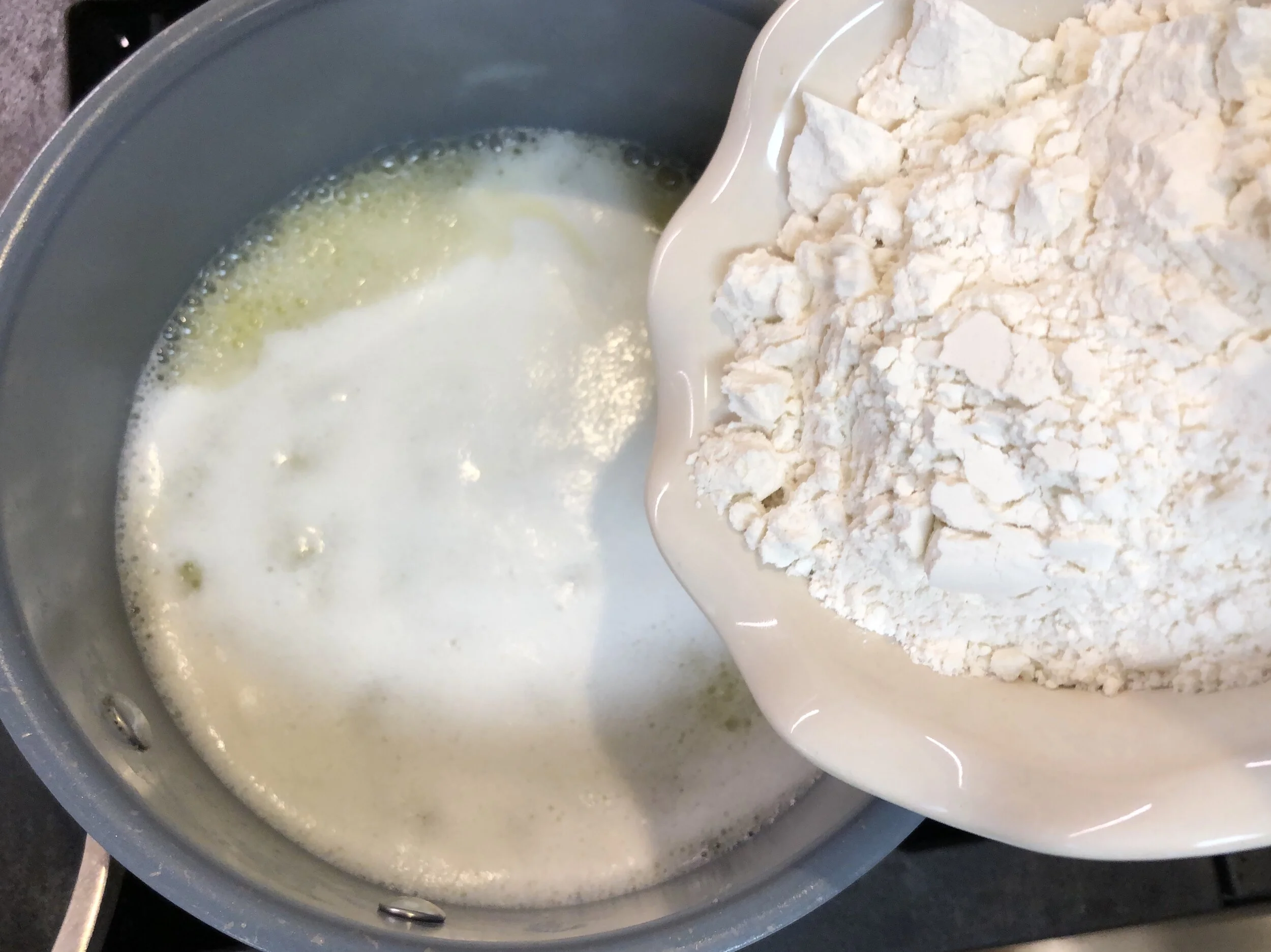All of the flour in at once.