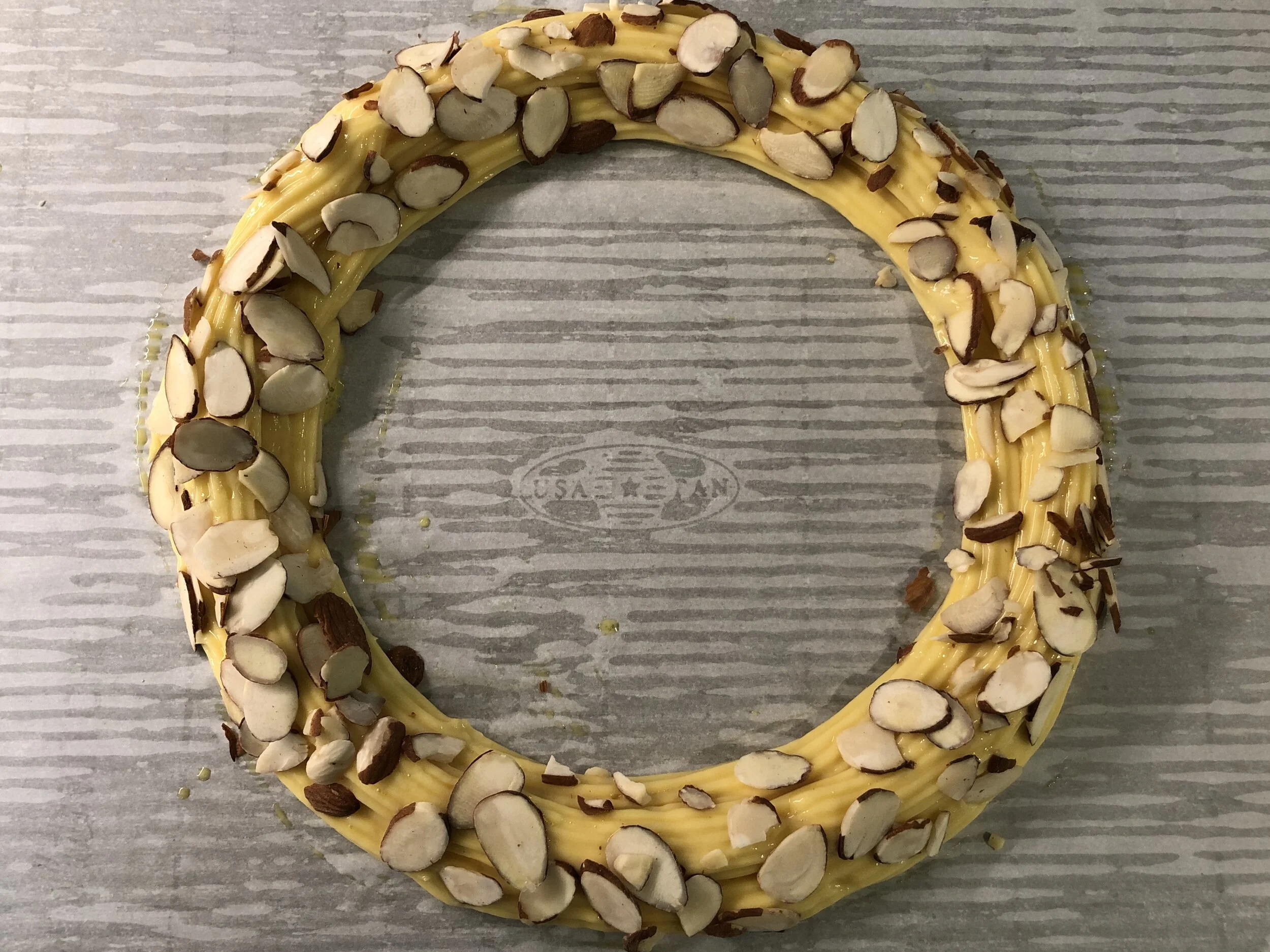 Brush the rings with egg wash, and coat with sliced almonds before baking.