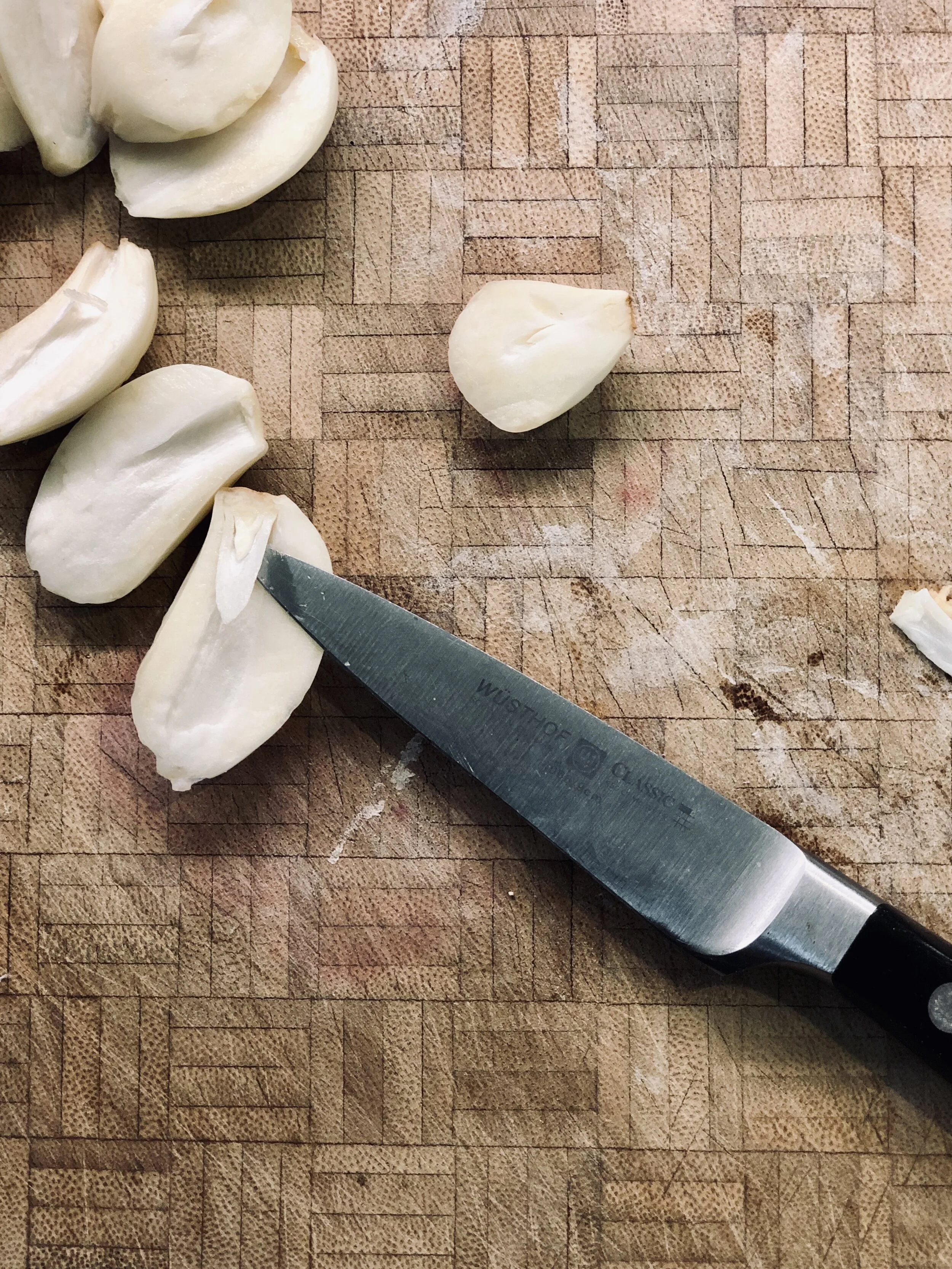 Removing the bitter germ from garlic.