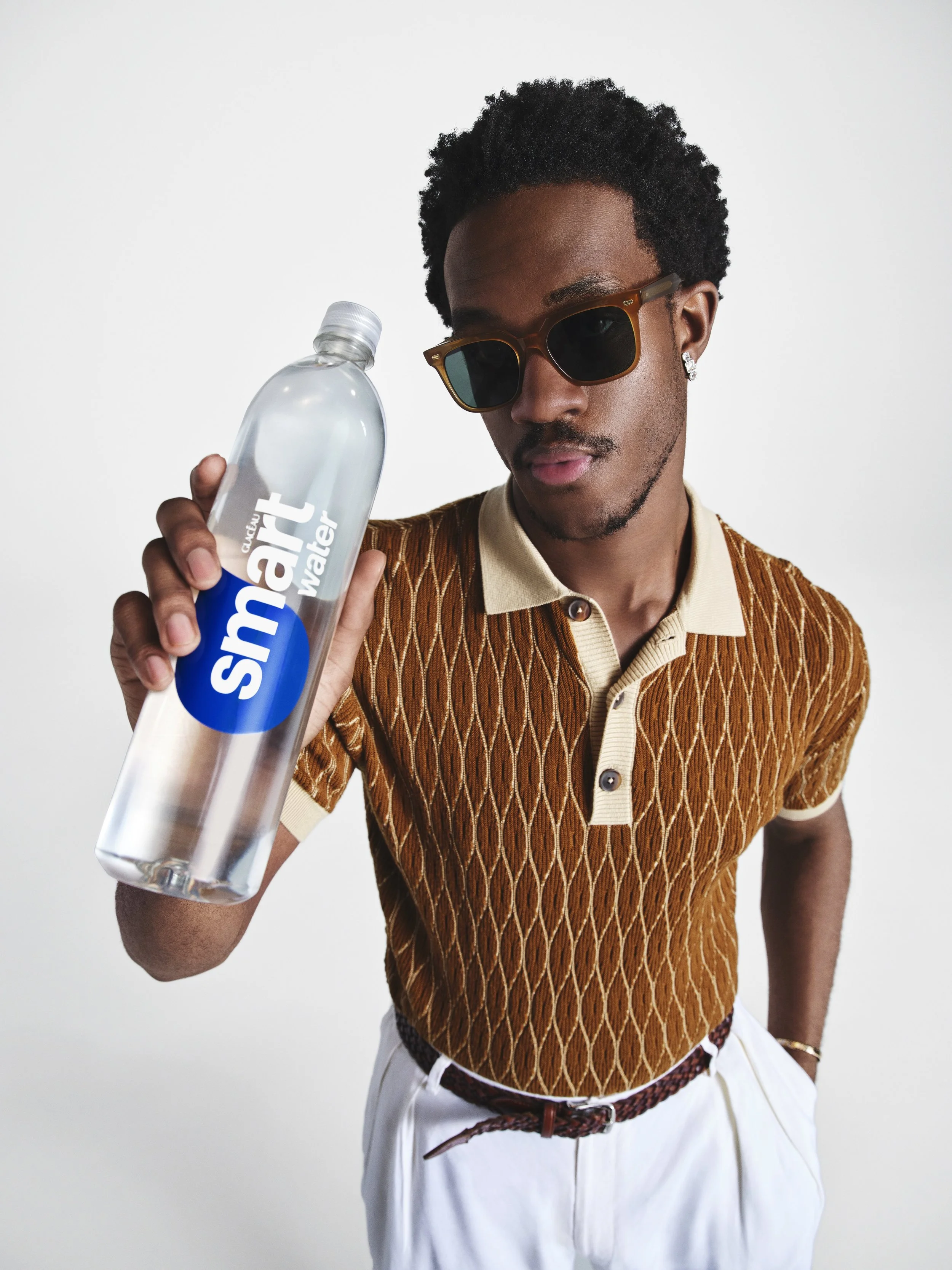 Wisdom brown shirt blue bottle.jpeg