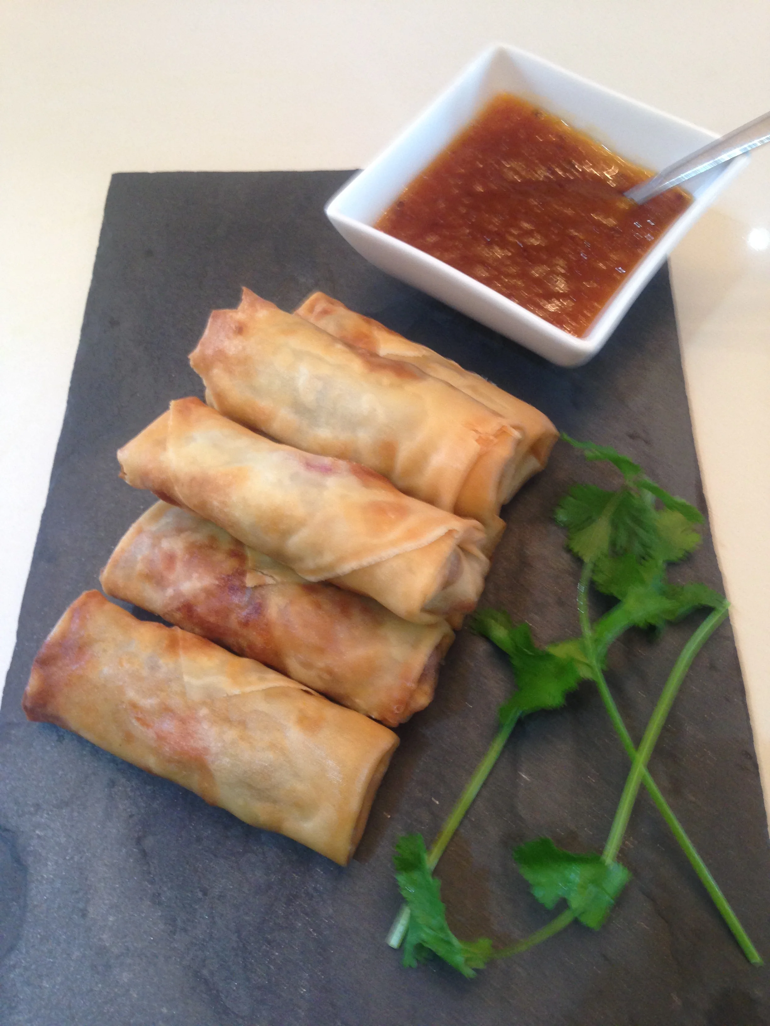 Finger food duck spring rolls with sweet chili sauce.jpg