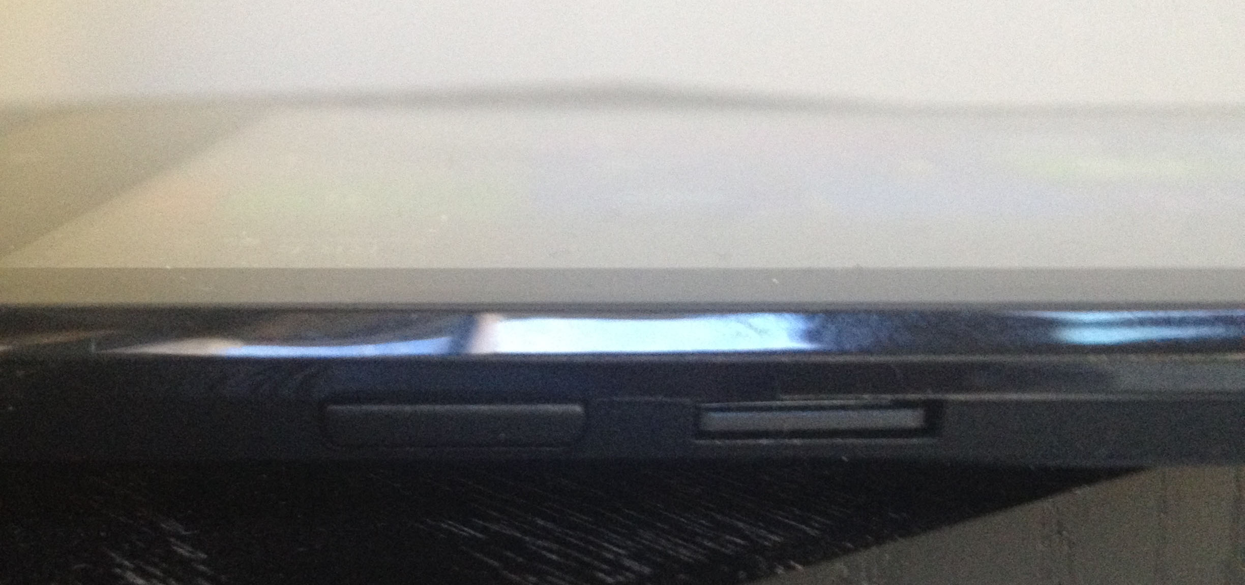 Unlike other Windows tablets, the physical Home button is along the opposite side (top left when the Asus logo is at the bottom in portrait mode). The SD slot comes loaded with an 8 GB card that contains a recovery partition. This is a very nice addition in a 32 GB device.