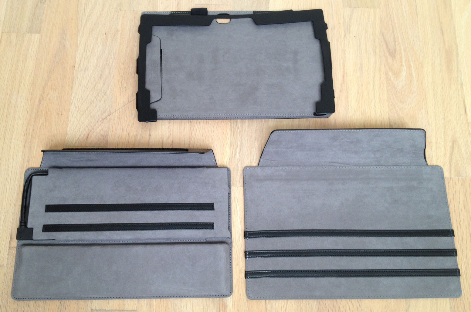 The ProKASE consists of three parts: the frame (above) holds the Surface Pro and has appropriate openings for the camera and the tablet's various other buttons, ports and vents. The other two parts are the dock cover (lower left) and the thin cover. The black strips sewn into both covers provide stops which duplicate the functionality of the Surface Pro kickstand.